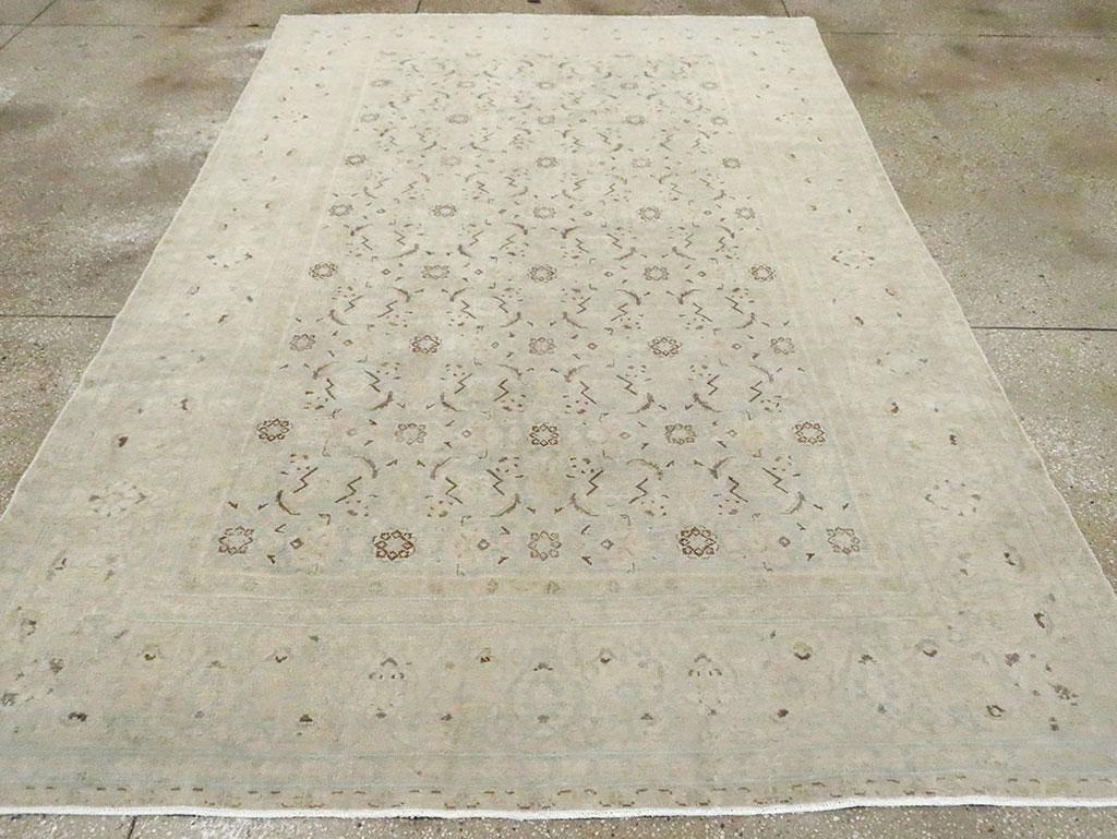 An antique Persian Malayer accent rug. The beige ivory field shows a recessive Herati design with notable dark brown marking bold, parenthetic lancet leaves and small octofoil rosettes. Dark umber spot accents also figure in the tonally reduced