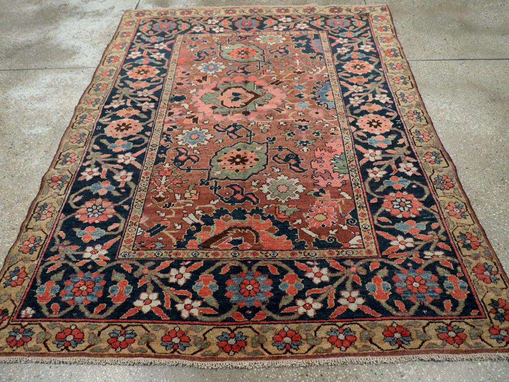 An antique Persian Northwest accent rug handmade during the Early 20th century.

Measures: 5' 1