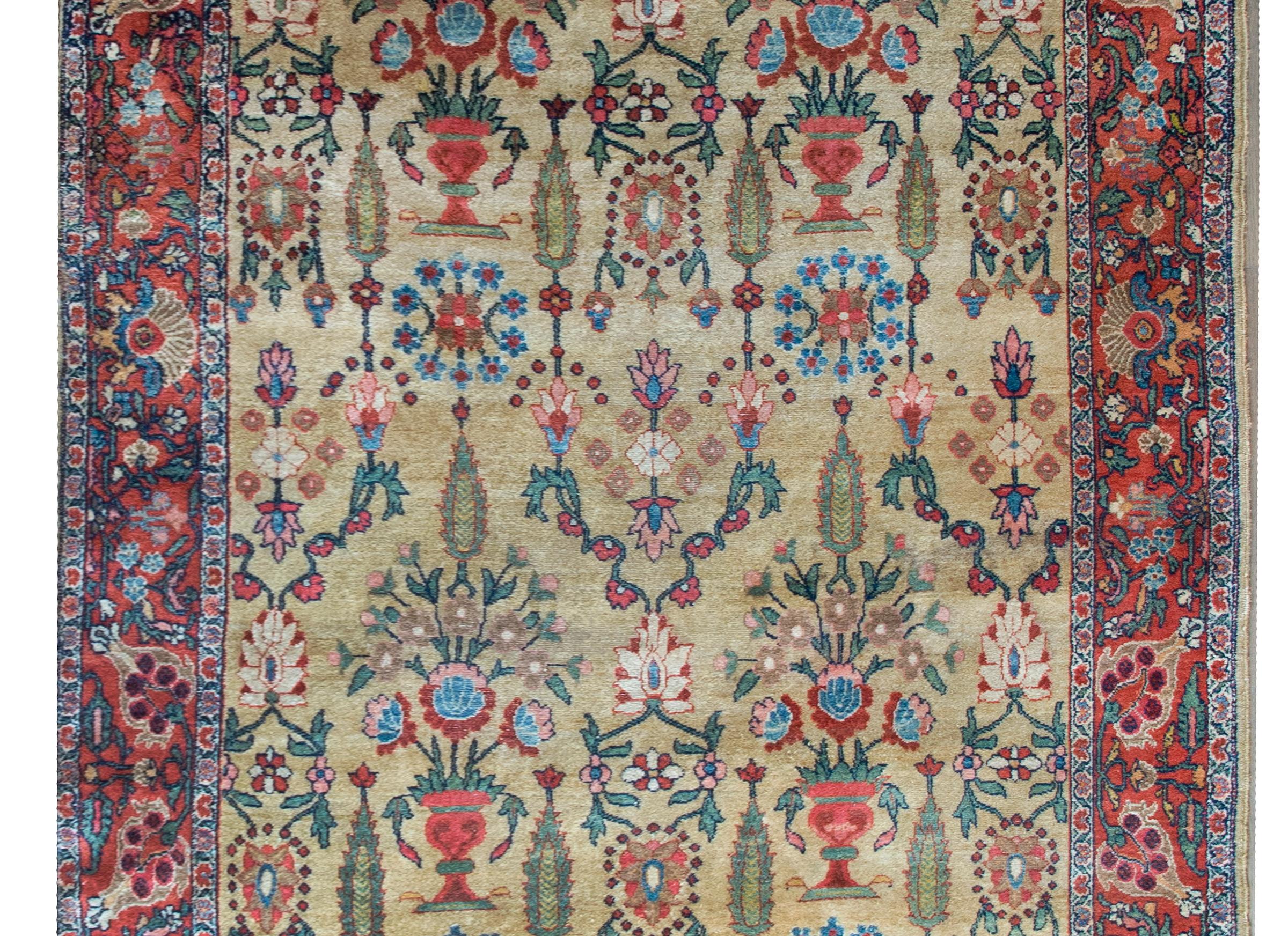 An extraordinary and impressive early 20th century Persian Sultanabad rug with the most beautiful all-over repeated floral potted vase pattern with scrolling vines and cypress trees, all woven in wonderful greens, crimsons, indigos, pinks, and