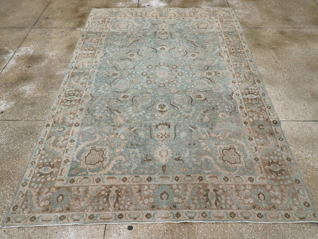 An antique Persian Tabriz accent carpet handmade during the Early 20th century.

Measures: 7' 2