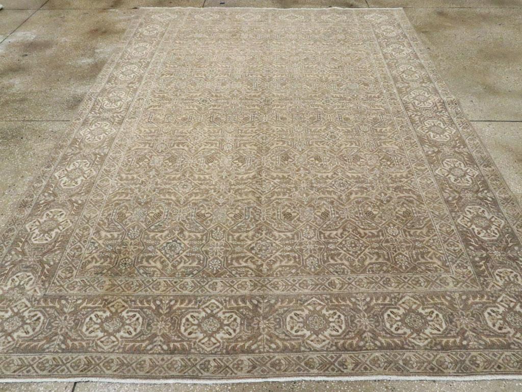 An allover version of the Herati pattern with added open cartouches and salient claw-fringed leaves closely fills the brown field and is framed by a strip-style main border with unusual sandy cream quatrefoils, not the usual reversing turtle border.