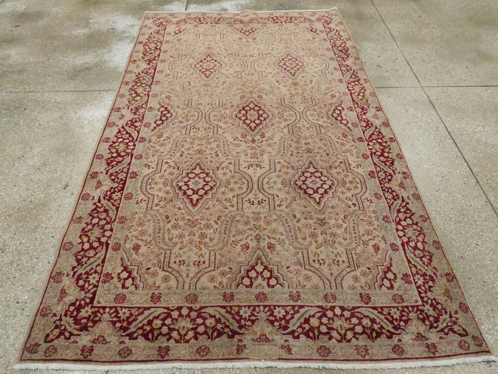 An antique Persian Tabriz accent rug handmade during the Early 20th century.

Measures: 4' 10