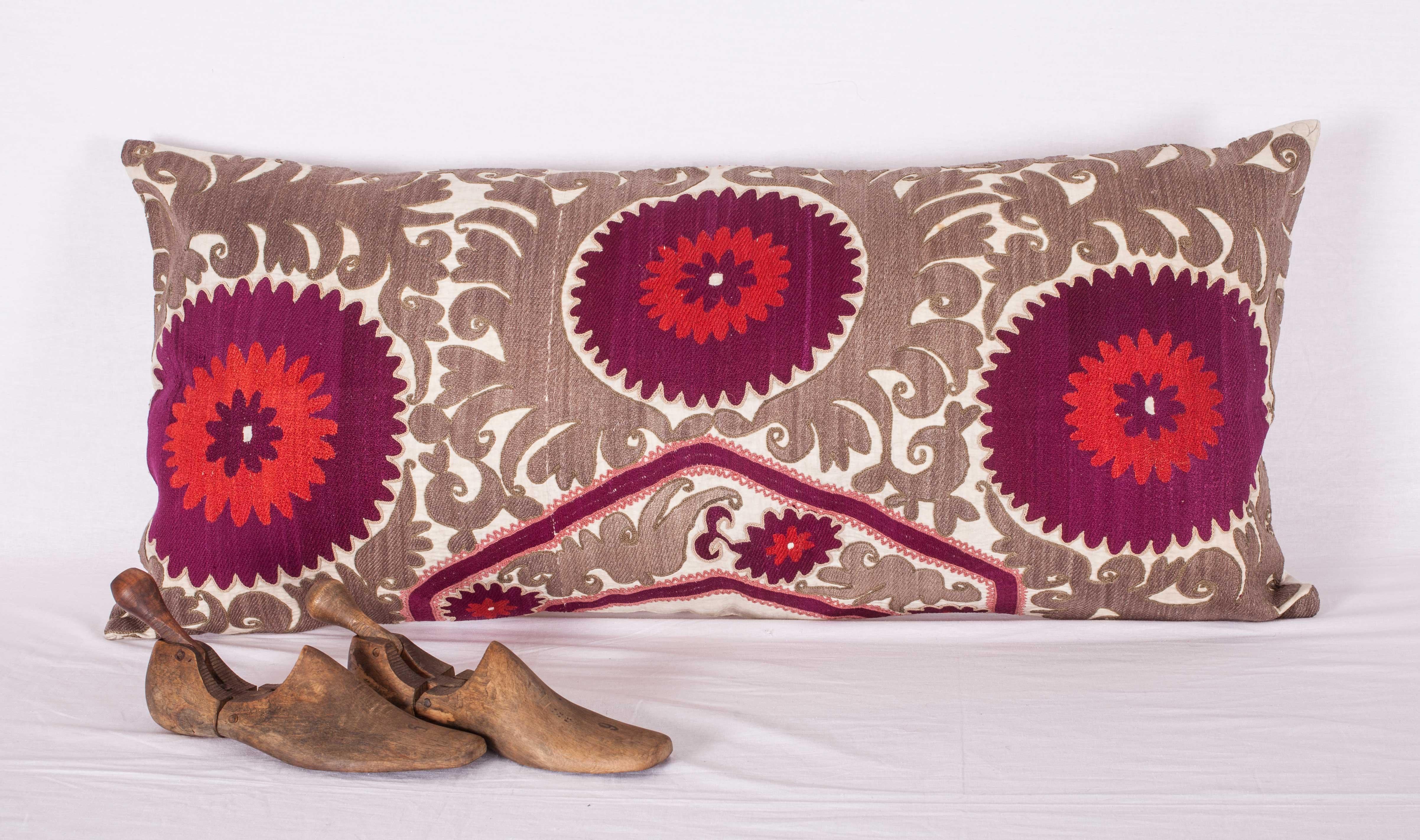 The pillow is made from an old Uzbek Samarkand Suzani. It does not come with an insert but comes with a bag made to the size and out of cotton to accommodate the filling. The backing is made of linen. Please note filling is not provided. Since the