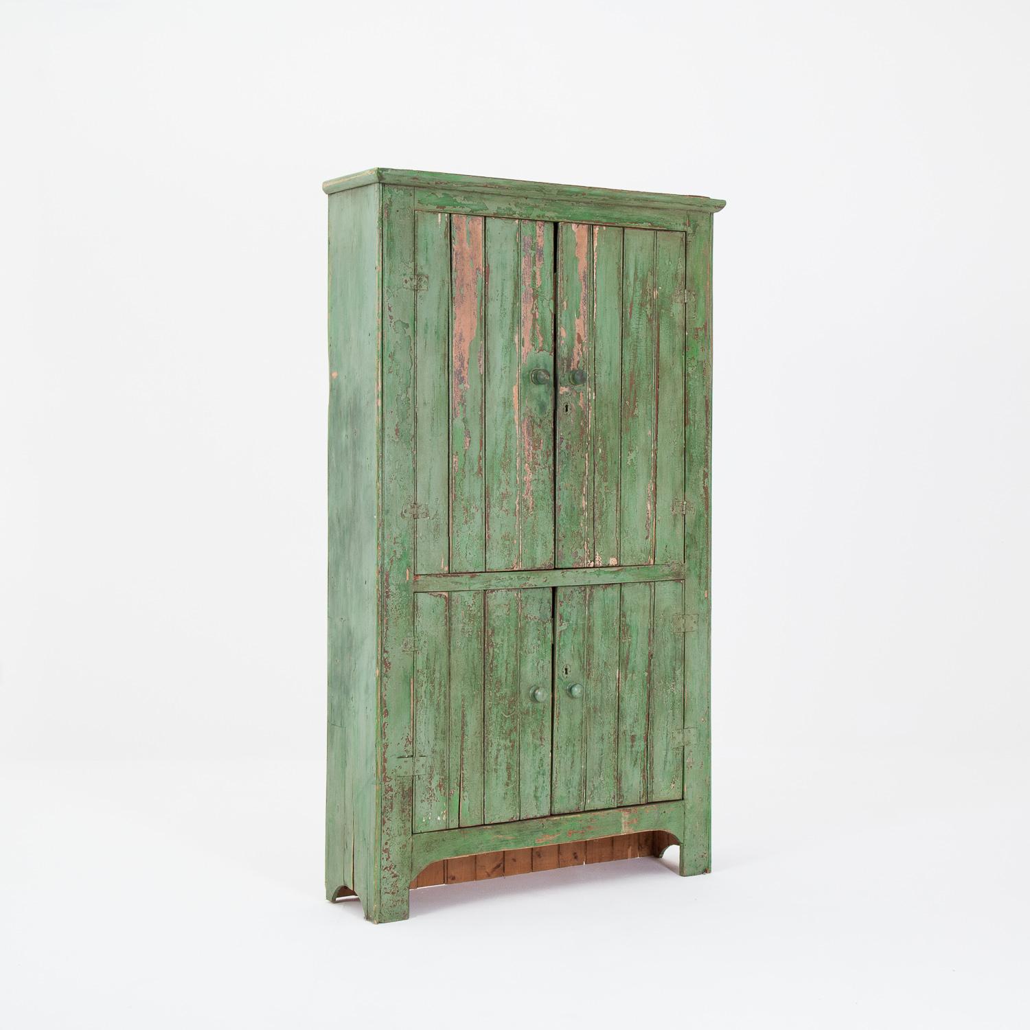 Charming pine painted green cupboard, in old paint.

The piece is shelved throughout. The back has been replaced at some point in the cupboard’s recent history.

Measures: Height 183cm x Width 106cm x Depth 29cm.
  