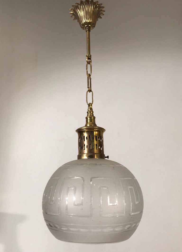 Early 20th Century Polished Brass And Hand Cut Glass Globe Pendant Engraved Early 20th Century Polished Brass And Hand Cut Glass Globe Pendant Light Fixture For