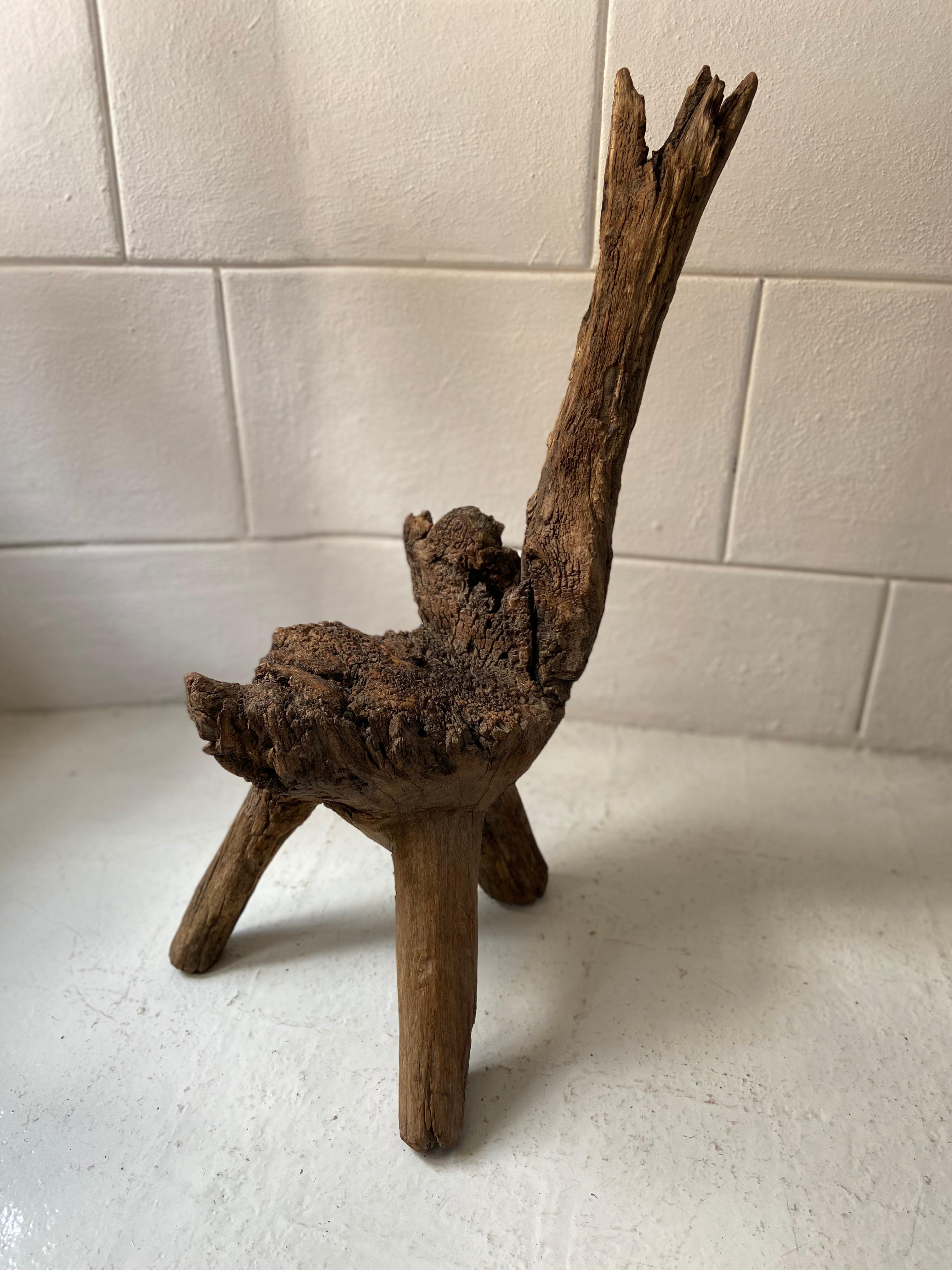 Rustic mesquite stool from San Felipe, Guanajuato, circa early 1900s. The seat is heavily weathered throughout. Mesquite will typically give off this look only after a very long period of time of enduring the elements. Mesquite is one of the hardest