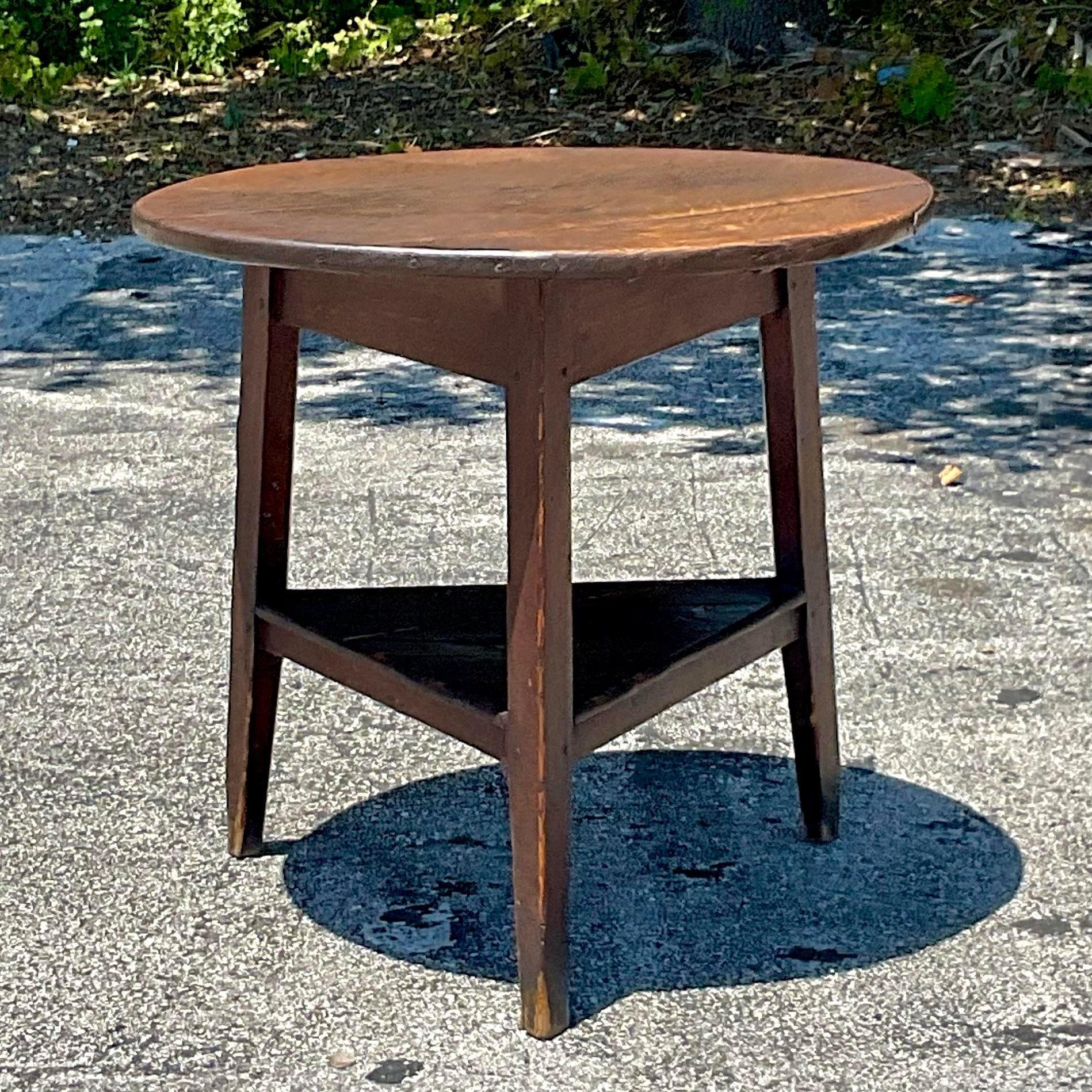 Add a touch of rustic elegance to your home with our Vintage Primitive Stained Oak Side Table, a nod to America's rich heritage of handcrafted furniture. Crafted from sturdy oak and featuring a charmingly stained finish, this table seamlessly blends
