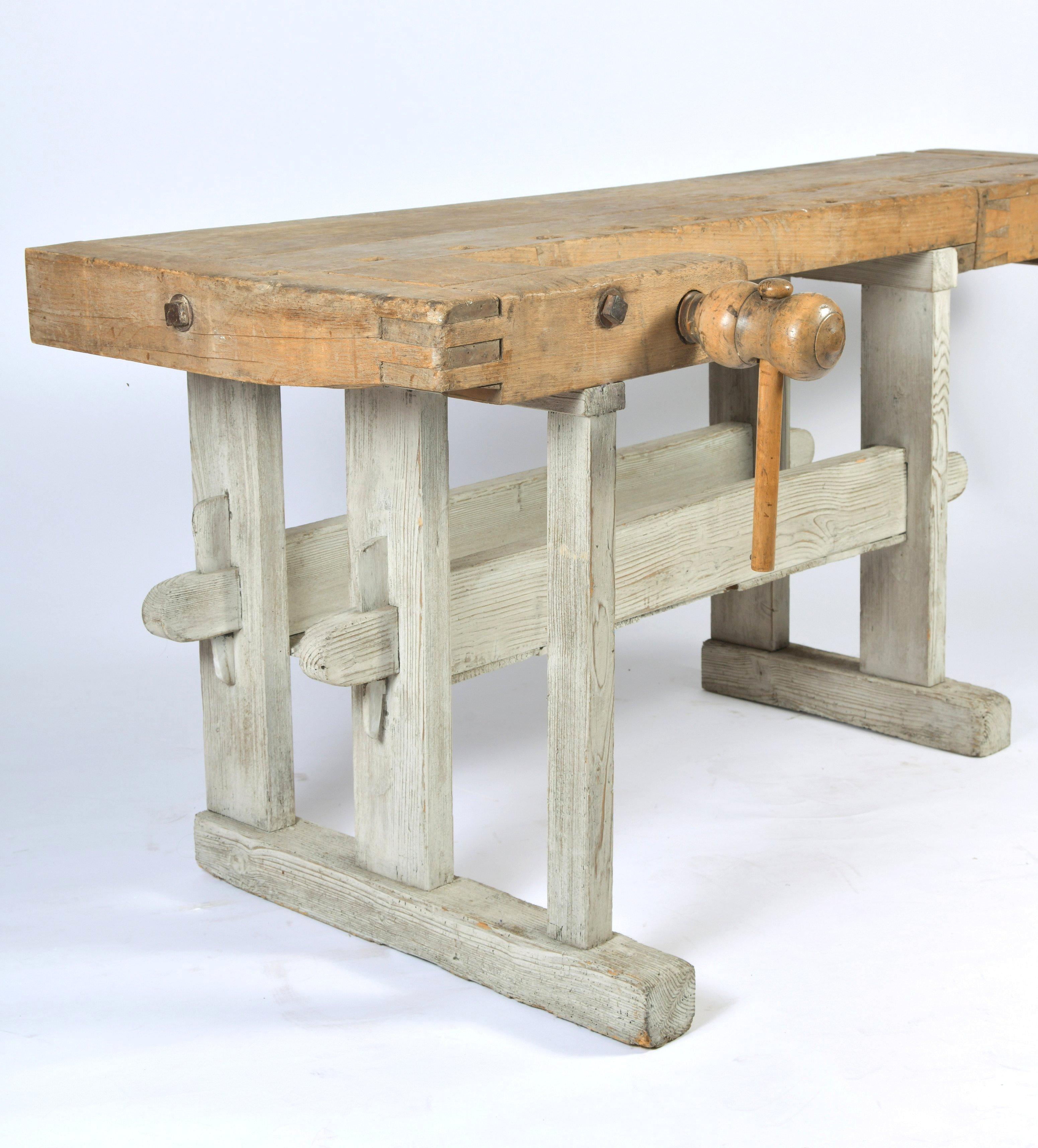 This fabulous Primitive wood workbench features a beechwood top with a painted white washed pine base. The maximum measurements including the screws are 81 in – 205.7 cm wide, 32 in – 81.2 cm deep and 31 3/4 in - 80.6 cm in height. The actual work
