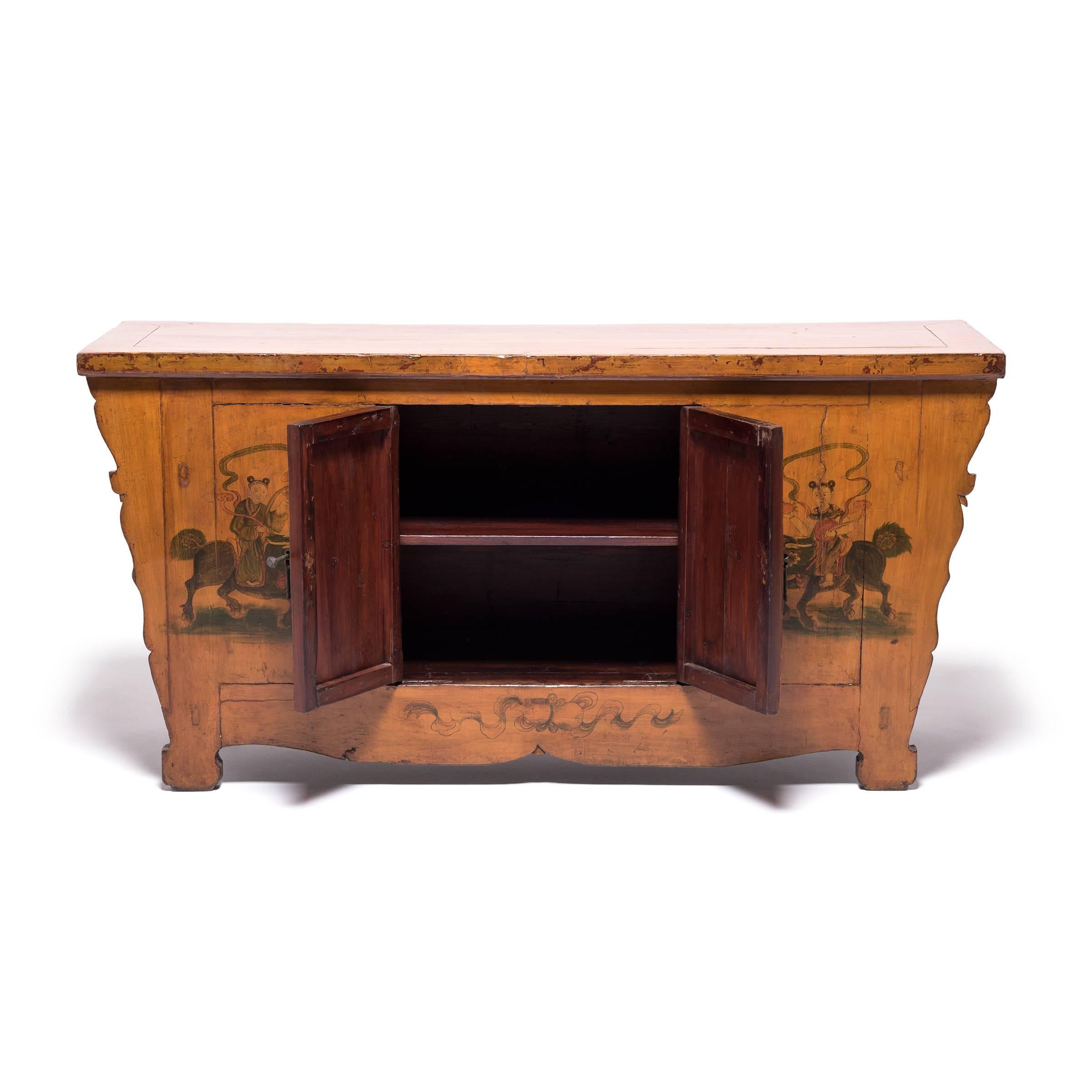 The paintings on this 19th century coffer from Mongolia are original and in impeccable condition. The hand-painted scene is fantastical—two traditionally dressed female figures are riding mythical Qilin lion dogs. The women are holding pomegranates