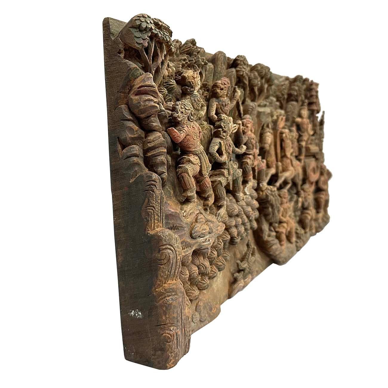 Wonderful hand carved wooden wall plaque with intricate detail of a scene from Ramayana. According to the Hindu epic Ramayana relates the story of the life of Rama, the seventh incarnation of the god Vishnu. It follows the story of his miraculous