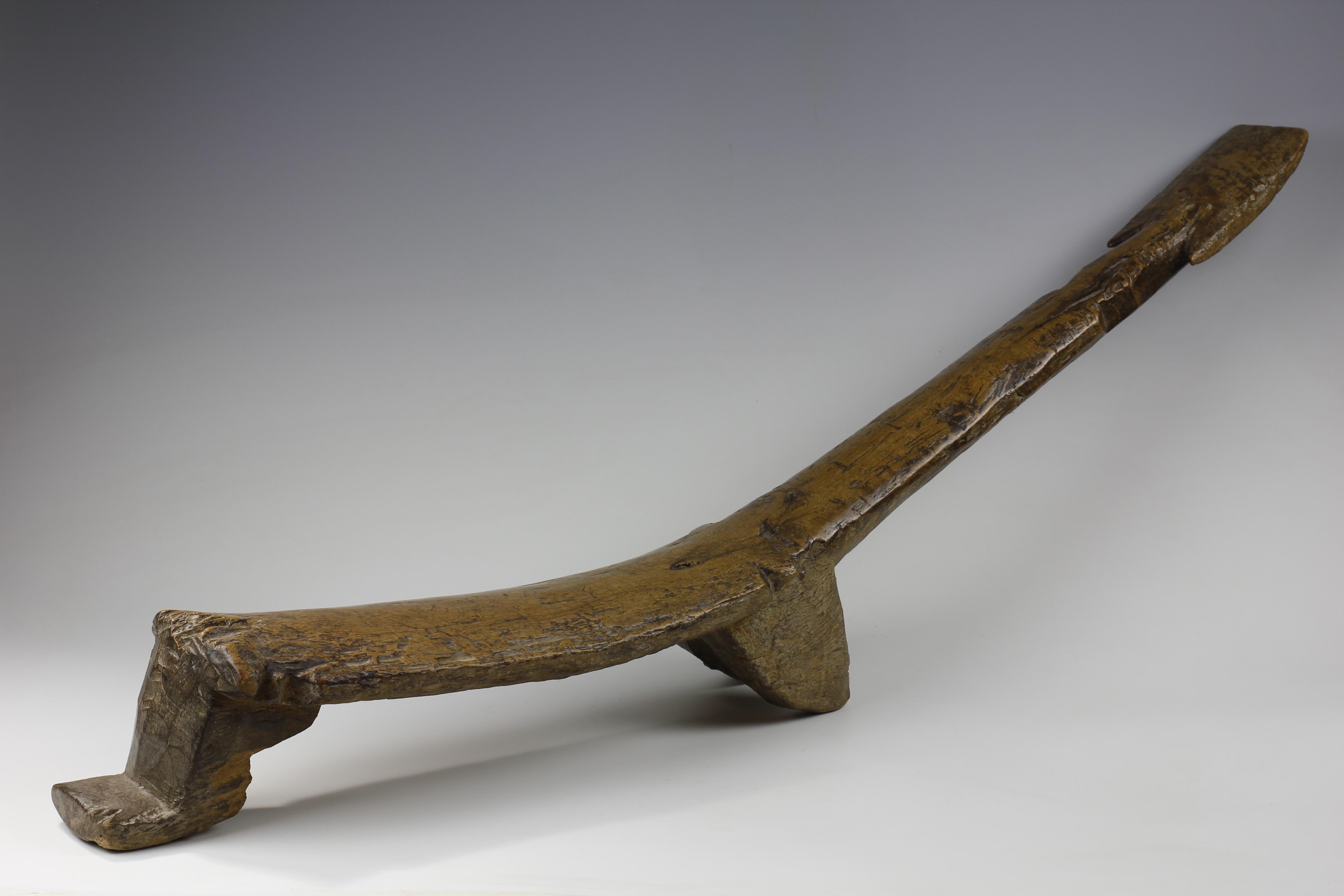 With a low seat supported by two splayed legs, this Lobi backrest from Burkina Faso exhibits a wonderful form with a long, reclining back support. Throughout, the surface of the piece has a deep, glossy patina. 

Pieces such as this were also