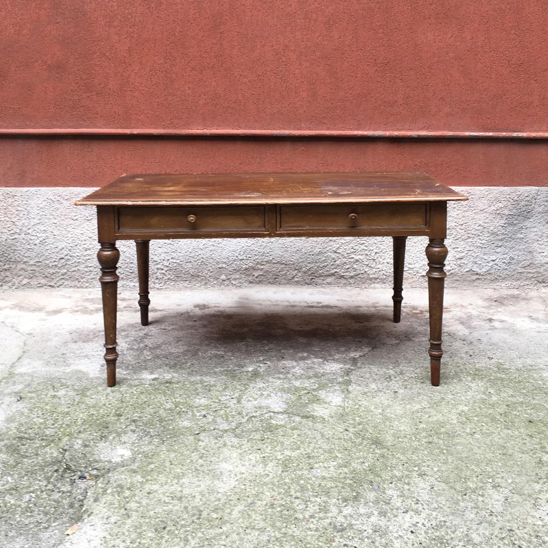 Italian early 20th century rectangular walnut kitchen table with turned legs, 1900s
Rectangular walnut kitchen table with two drawers and knobs also in wood, drawn frame and turned legs.
Good structural condition, but plan to be