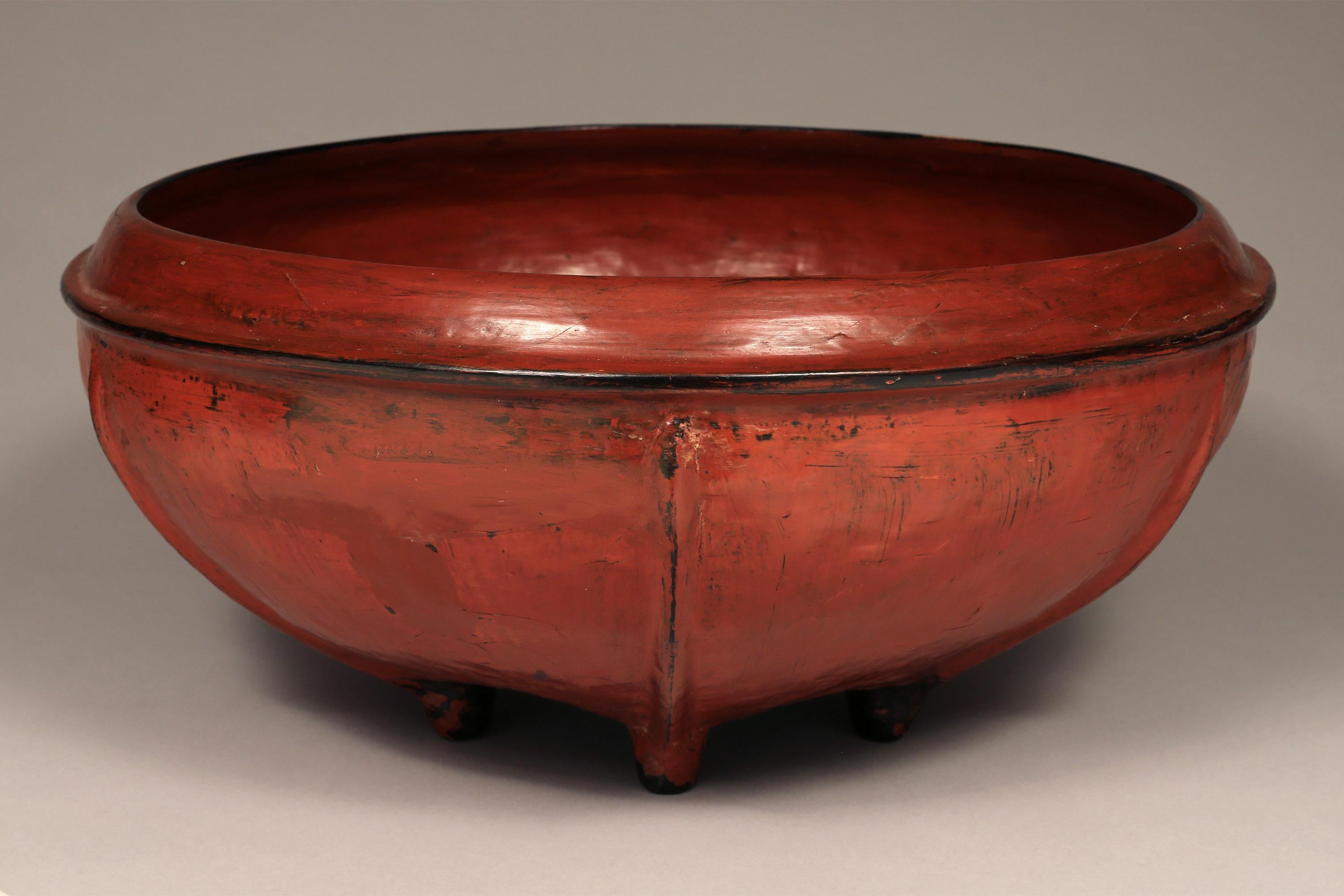 Burmese woven bamboo and red lacquered offering bowl, early 20th century

This lovely offering bowl features six ribs and six feet.
Woven bamboo is lacquered in layers - first black, then red achieving the distinctive look of Burmese lacquerware.