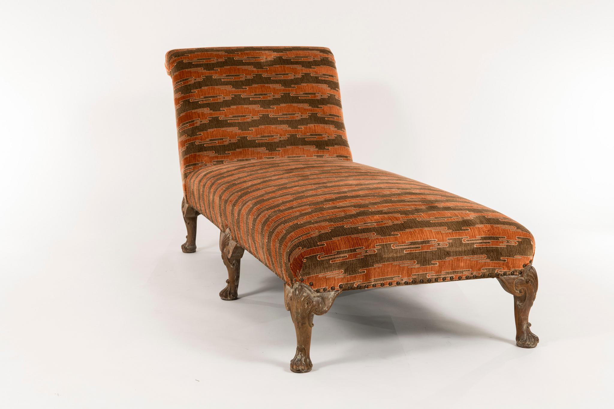 A wonderful carved early 20th century Regency style chaise newly upholstered in a contemporary Kelly Wearstler velvet chenille.