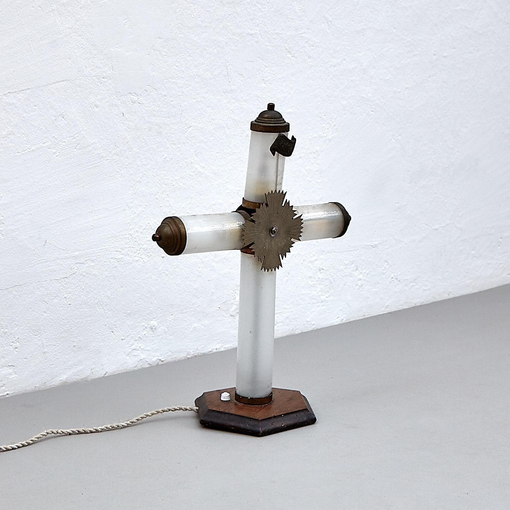 Early 20th century religious table lamp.

Manufactured in France, circa 1940.

In original condition with minor wear consistent of age and use, preserving a beautiful patina.

Materials: 
Metal, glass

Dimensions: 
D 17 cm x W 38 cm x H 49
