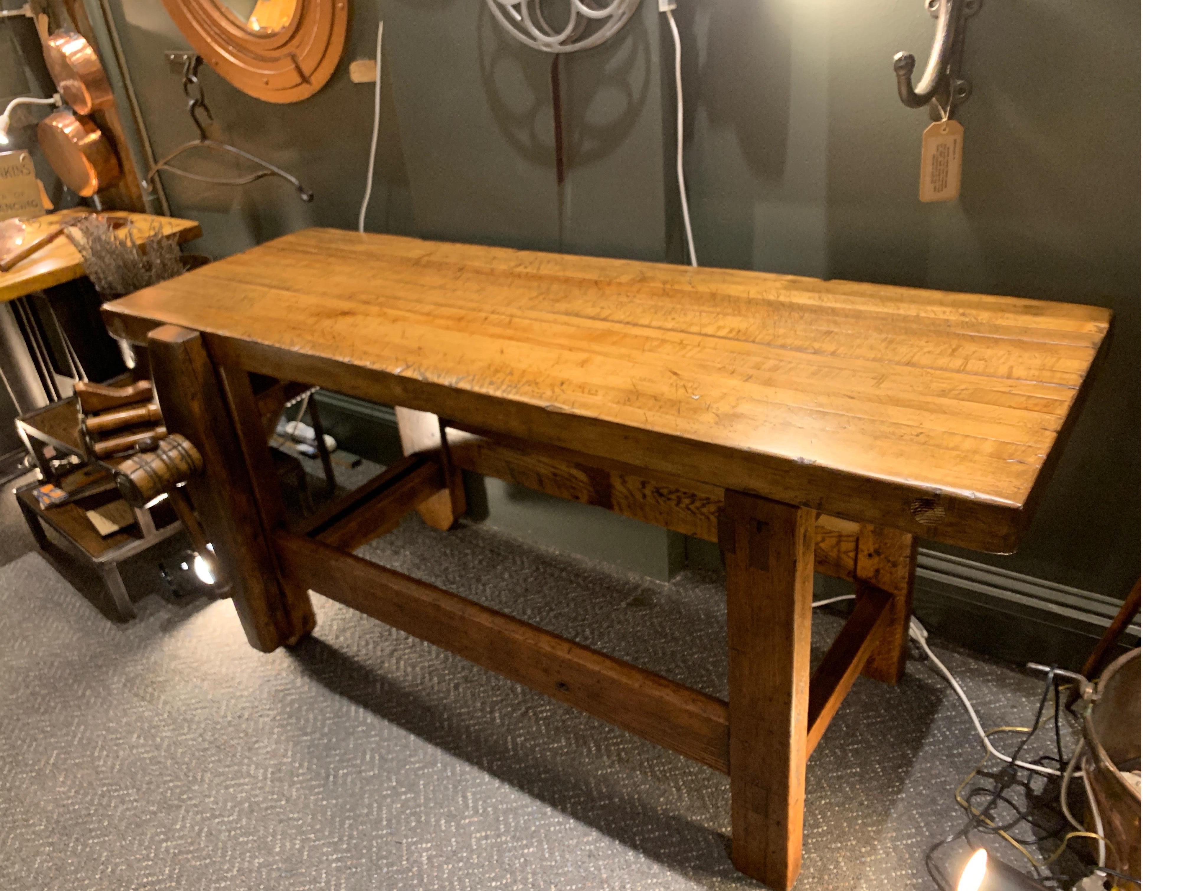 Workbench which has been beautifully restored showing decades of use and is ready for your home, wine cellar of office. The wood has an abundance of character and a soft mellow tone. The maple wood top measures 2.75 inches thick. It's wooden screw