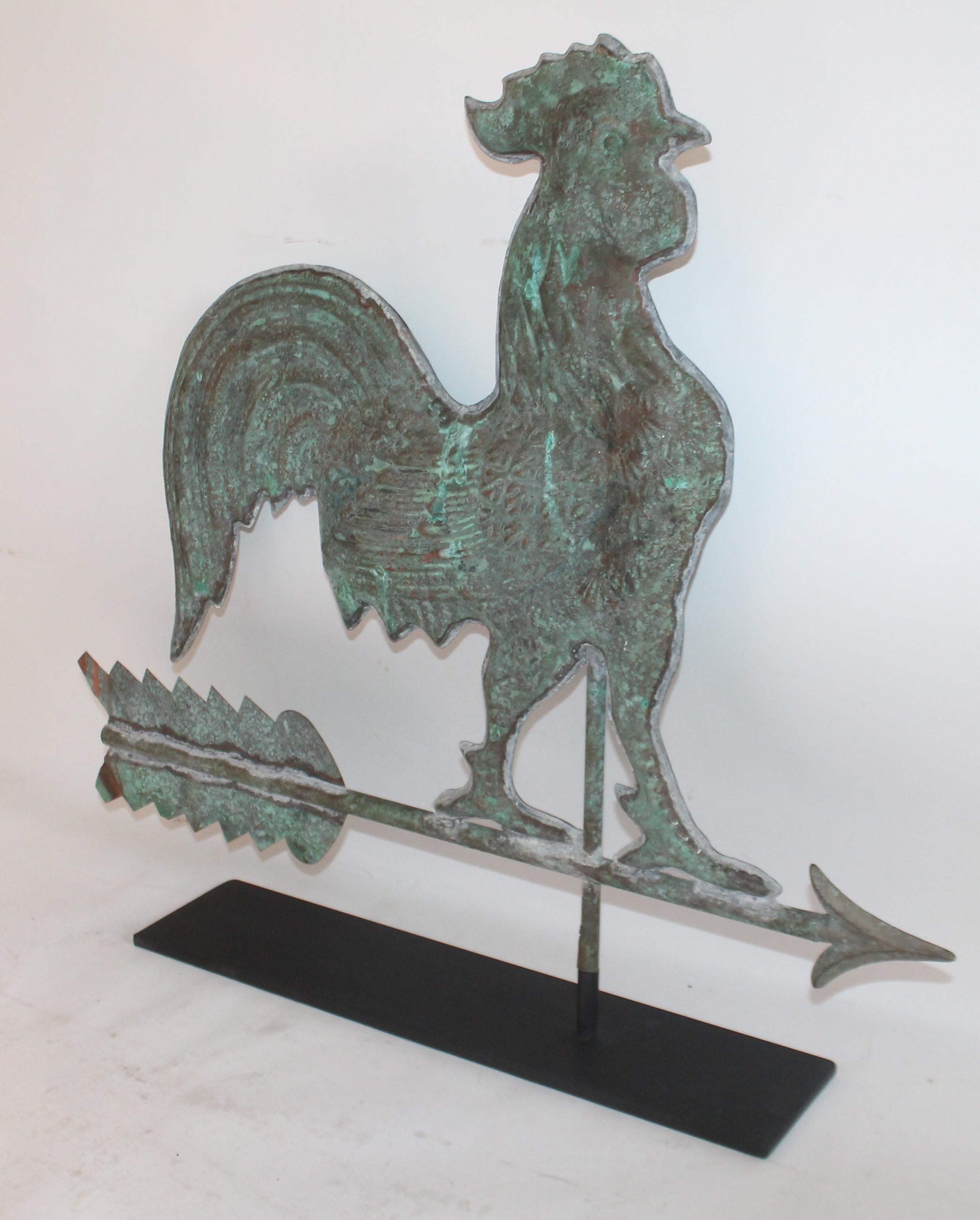 Early 20th century rooster copper full body weather vane with amazing aged patina. This comes with a custom made iron stand. It's from the early 20th century and in good condition with minor dings or small dents.