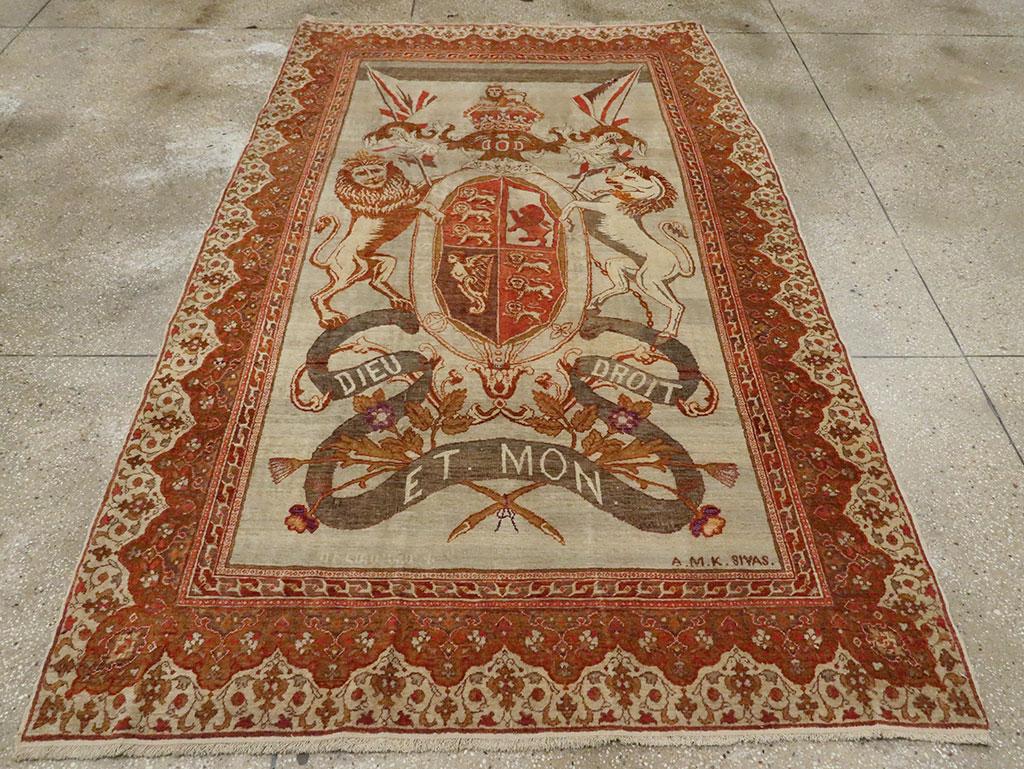 An antique Turkish Sivas accent rug handmade during the early 20th century with a pictorial design of the 'Royal Coat of Arms of the United Kingdom.' 

Measures: 5' 4
