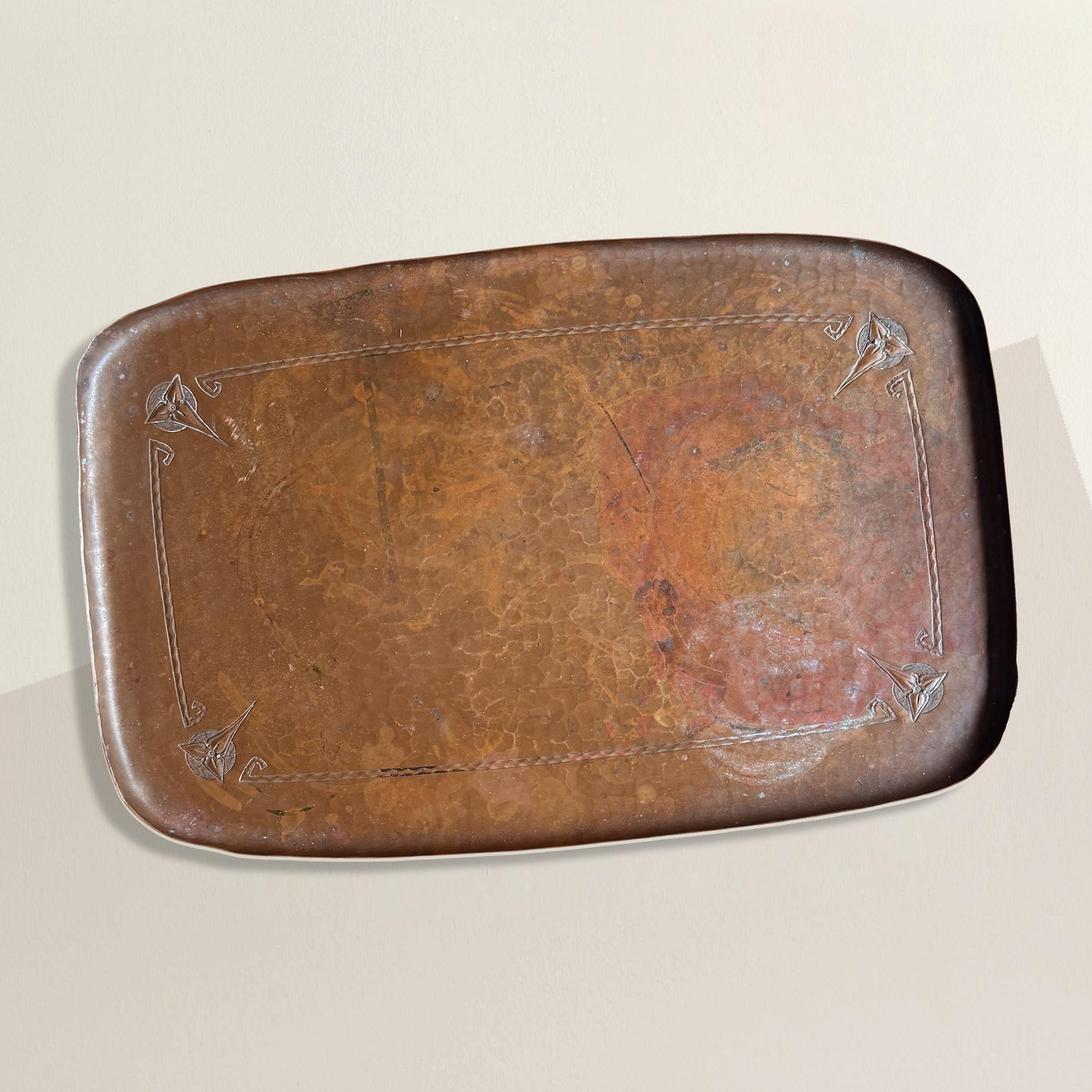 In the canon of American Arts and Crafts, few names command reverence like Roycroft—and few objects better capture its ethos than this hammered copper tray. Made circa 1910, its surface glows with the hand-wrought irregularities that machines can