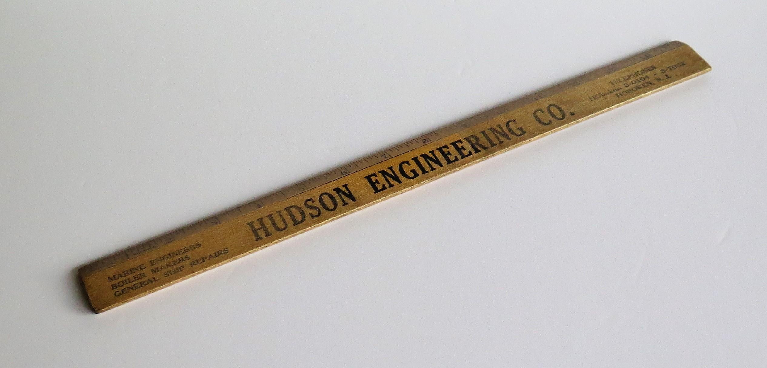 This is a wooden desk ruler promoting the Hudson Engineering Co. who were based in Hoboken, New Jersey, US and produced by Geiger Brothers of Newark New Jersey, in the early 20th century. 

The hard wood ruler is 15 inches long and is printed /