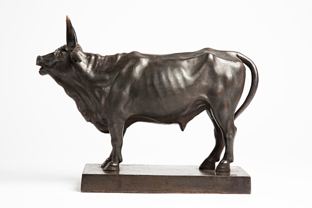 Entirely made out of cast iron, this Russian iron sculpture represents a bull stands over a rectangular base. Fully detailed.