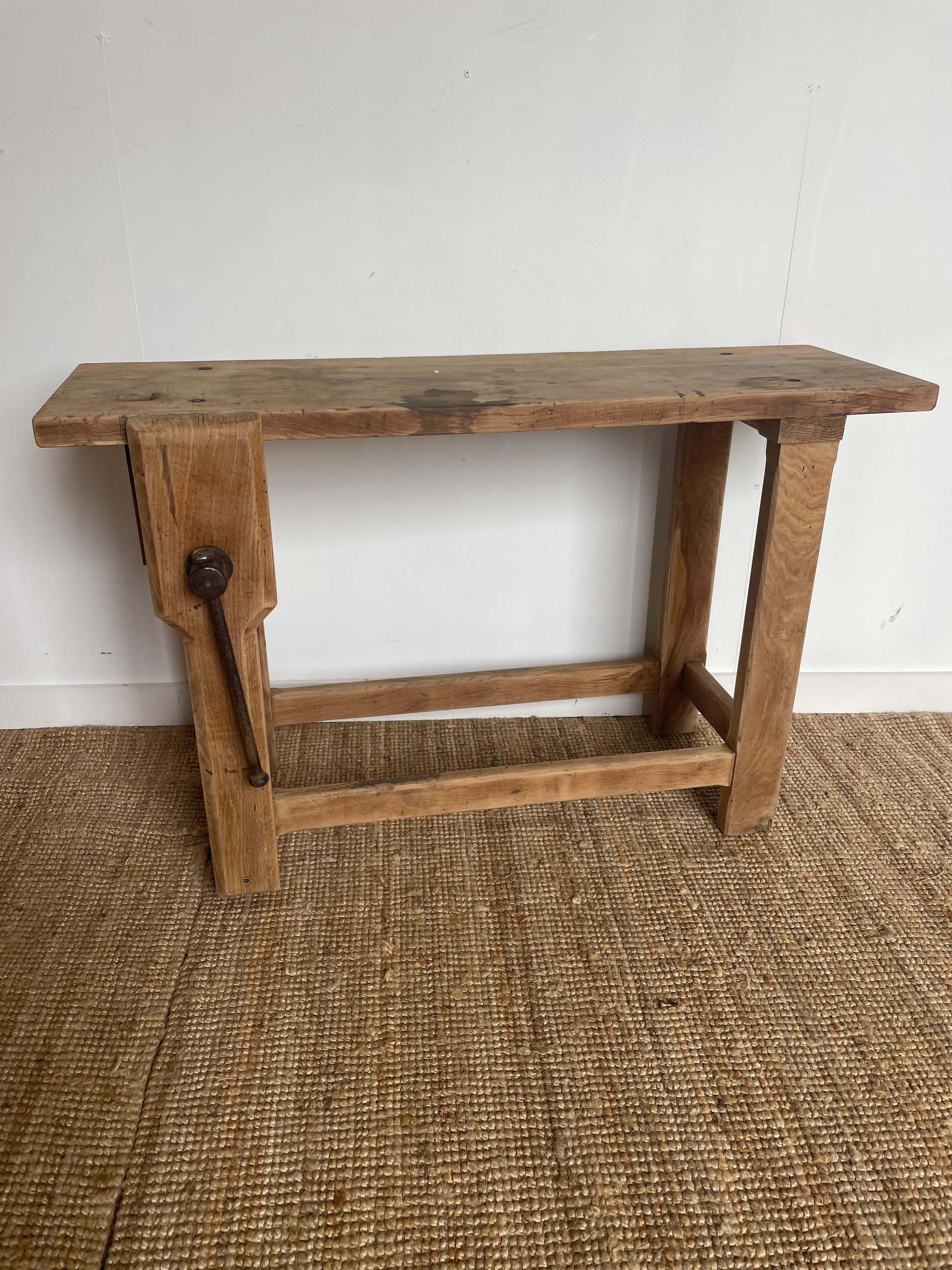 Early 20th century scrubbed oak rustic console/ work bench. 

This bench has been washed and scrubbed to give it a contemporary feel and its a great decorative item. 

Circa 1930.  

H: 81 cm (31 7/8