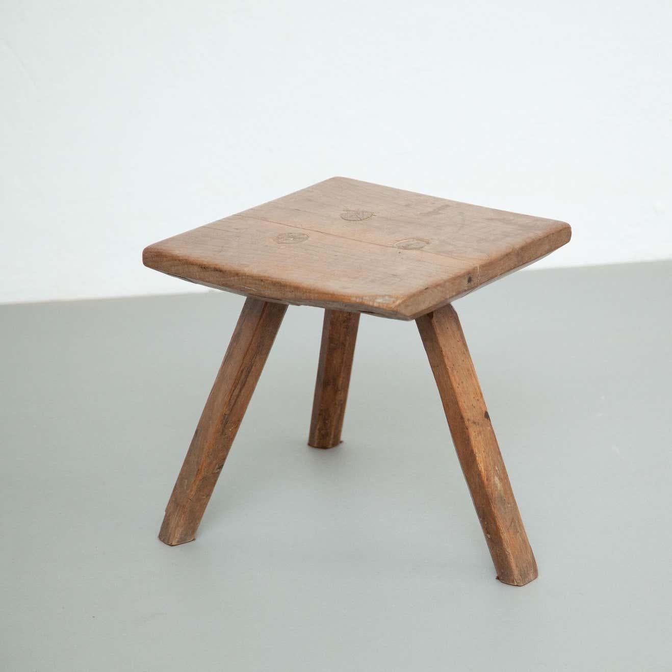 Rustic French stool.
By unknown manufacturer from France, circa 1930.

In original condition, with minor wear consistent with age and use, preserving a beautiful patina.

Material:
Wood.

