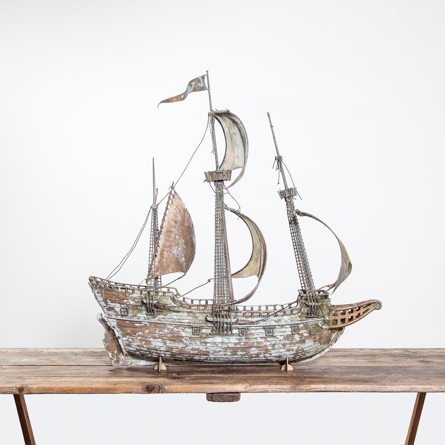 Early 20th century scratch-built model of a galleon.

The piece sits on a small bespoke metal stand and has numerous small breakages and missing elements.

Height 99cm x Length 96cm x Width 39cm.
     