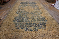 Distinguished Blue Ground and Exquisite Floral Detail Antique Persian Kerman Rug