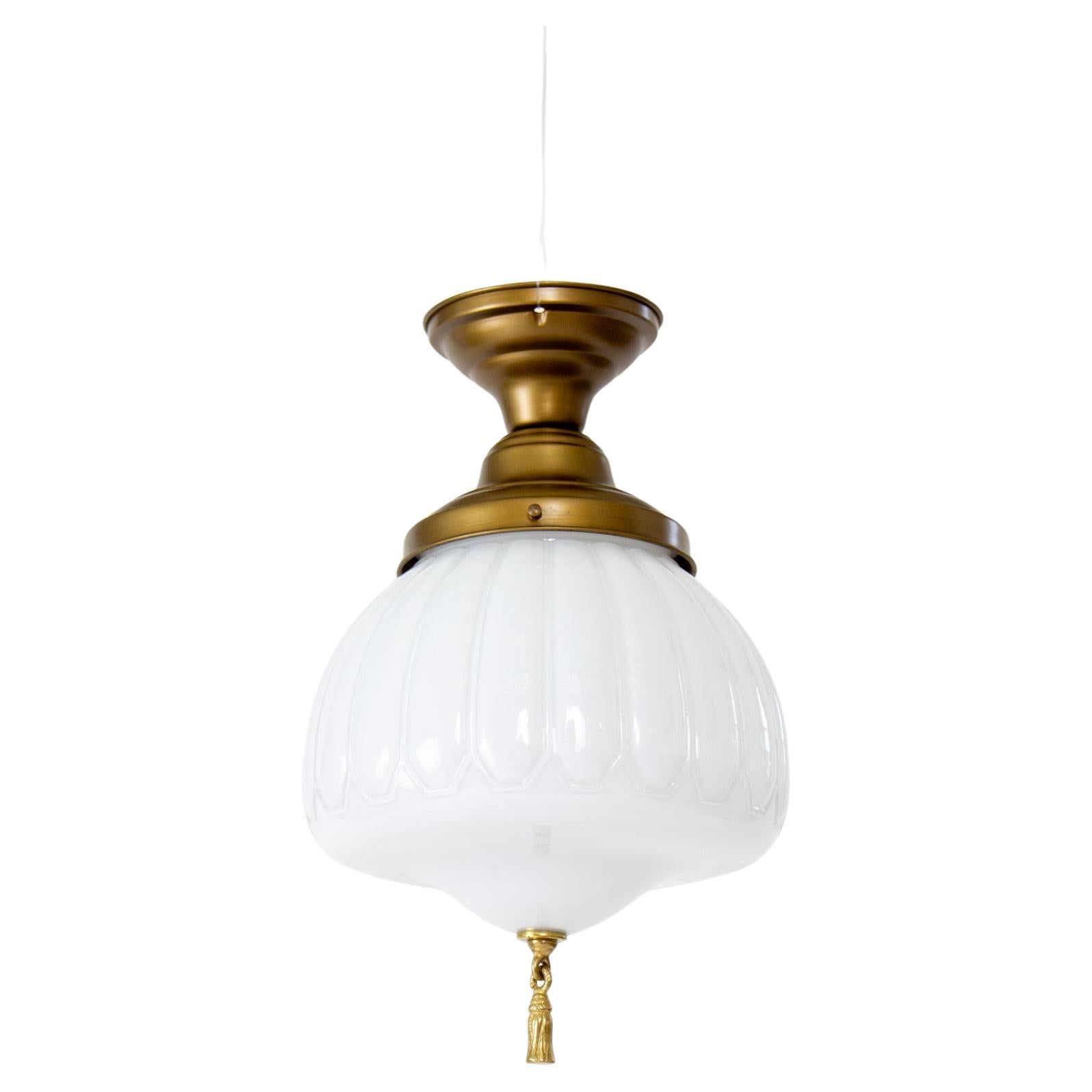 Early 20th Century Semi Flush White Case Glass Fixture With Bronze Tassel For Sale