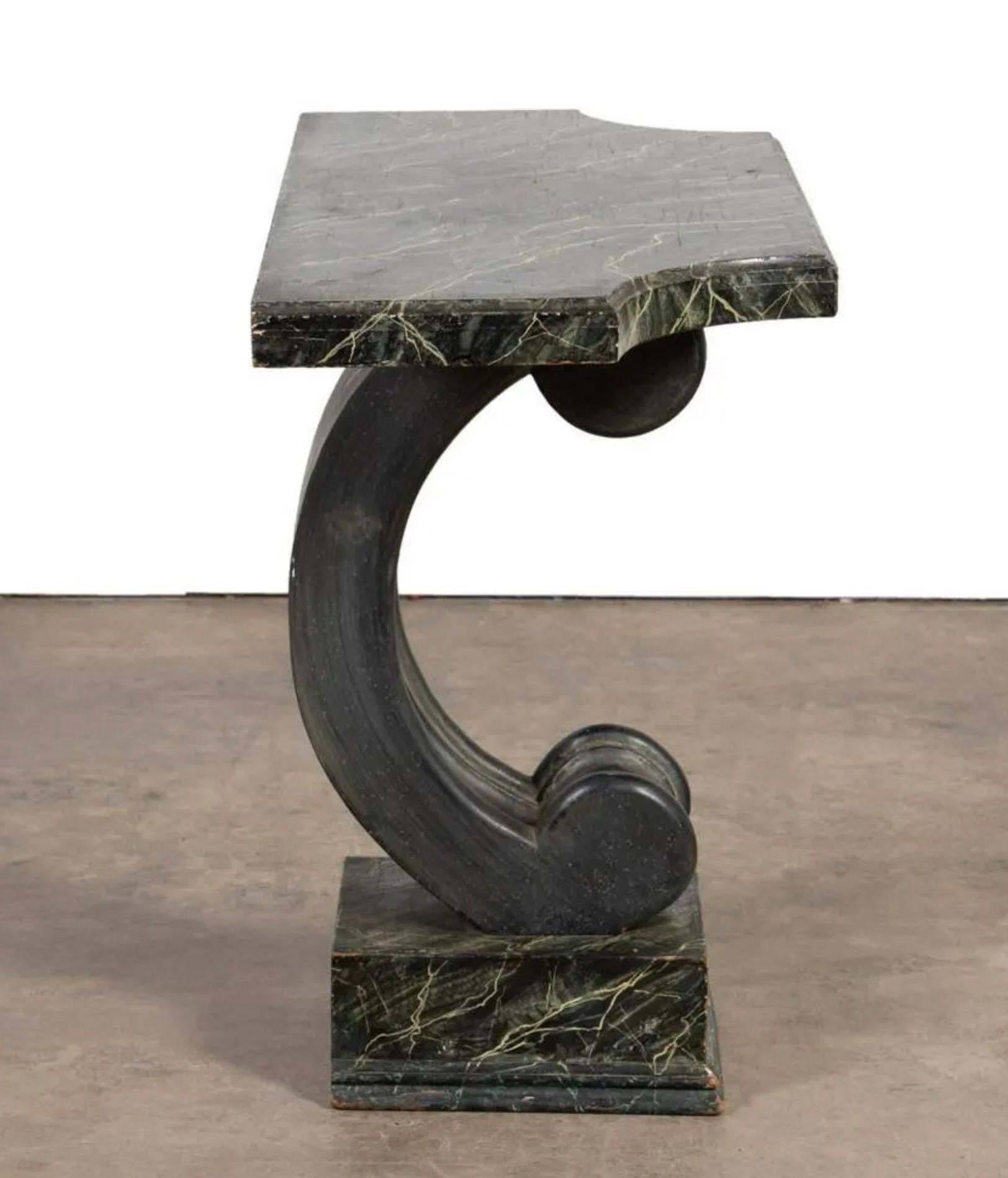 Serge Roche (French 1898-1988), style scroll form console table, having a faux marble molded top supported by a 