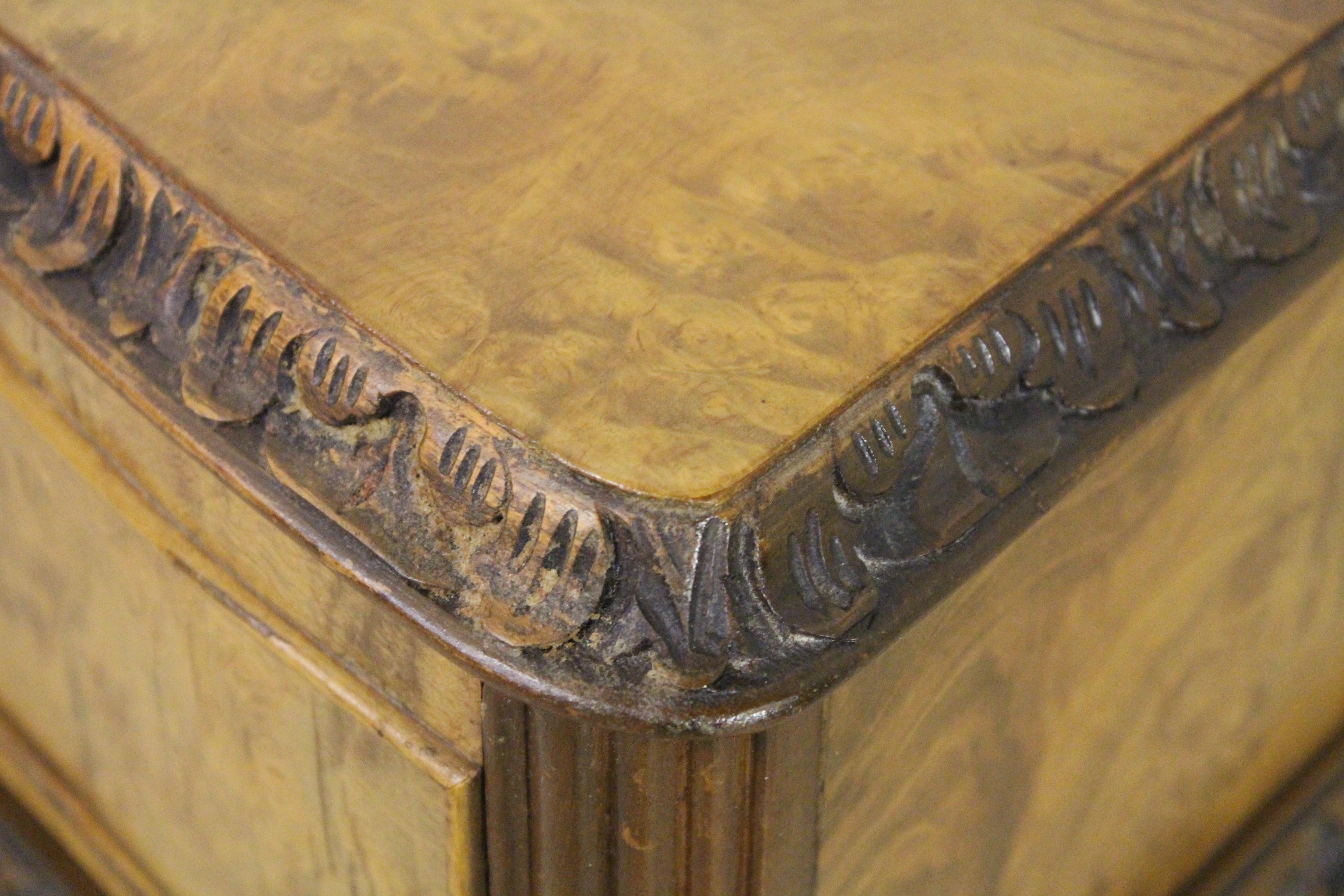 A splendid serpentine shaped side table in the Queen Anne style. Well made from solid walnut with attractive burr walnut veneers. The serpentine shaped top is decorated with a carved border to the edge. Further carved decoration is found to the