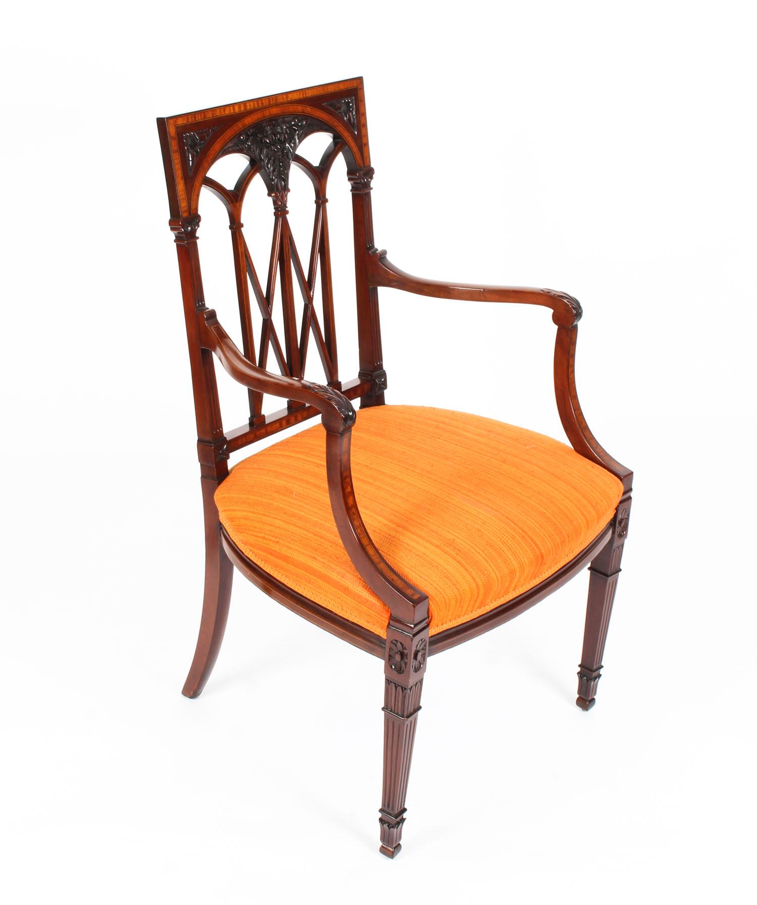 A striking set of six mahogany and satinwood banded dining chairs, in Sheraton Revival taste, to include a pair of armchairs, circa 1900 in date.

The high back chairs feature satinwood banding with boxwood and ebonized line inlay and wonderful