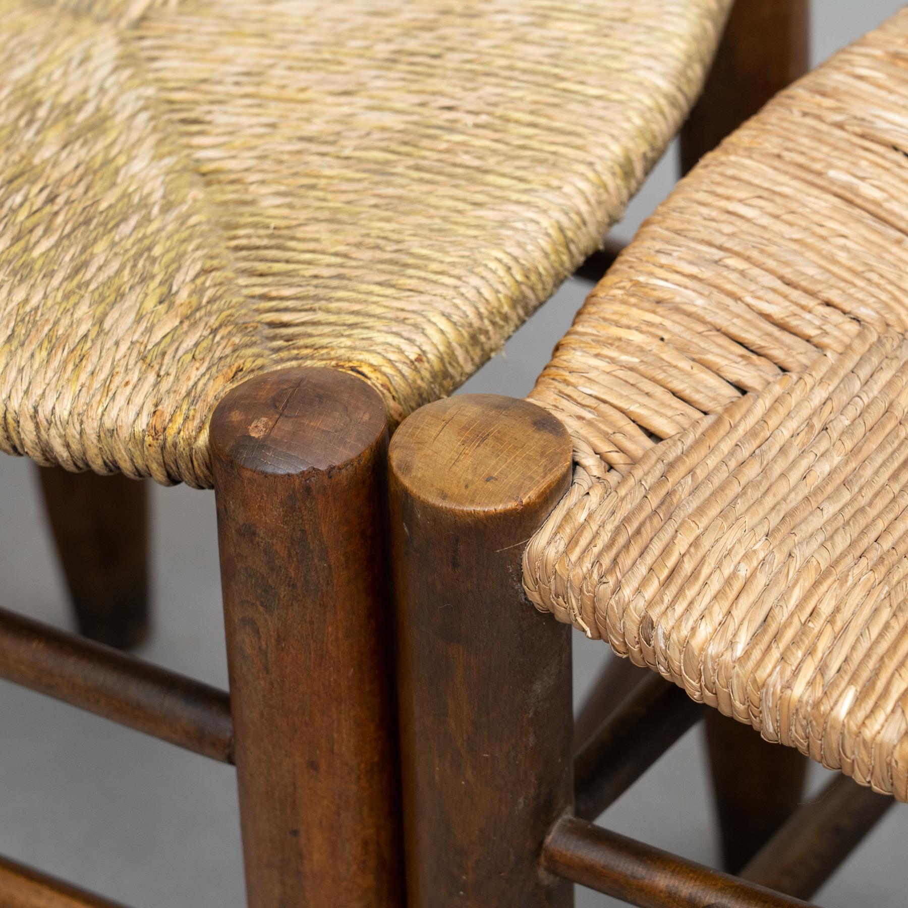 Early 20th century set of two chairs. Wooden chairs with a traditional rattan seat.

In good original condition, with minor wear consistent with age and use, preserving a beautiful patina.

Materials:
Wood
Rattan

Dimensions:
D 44.5 cm x W