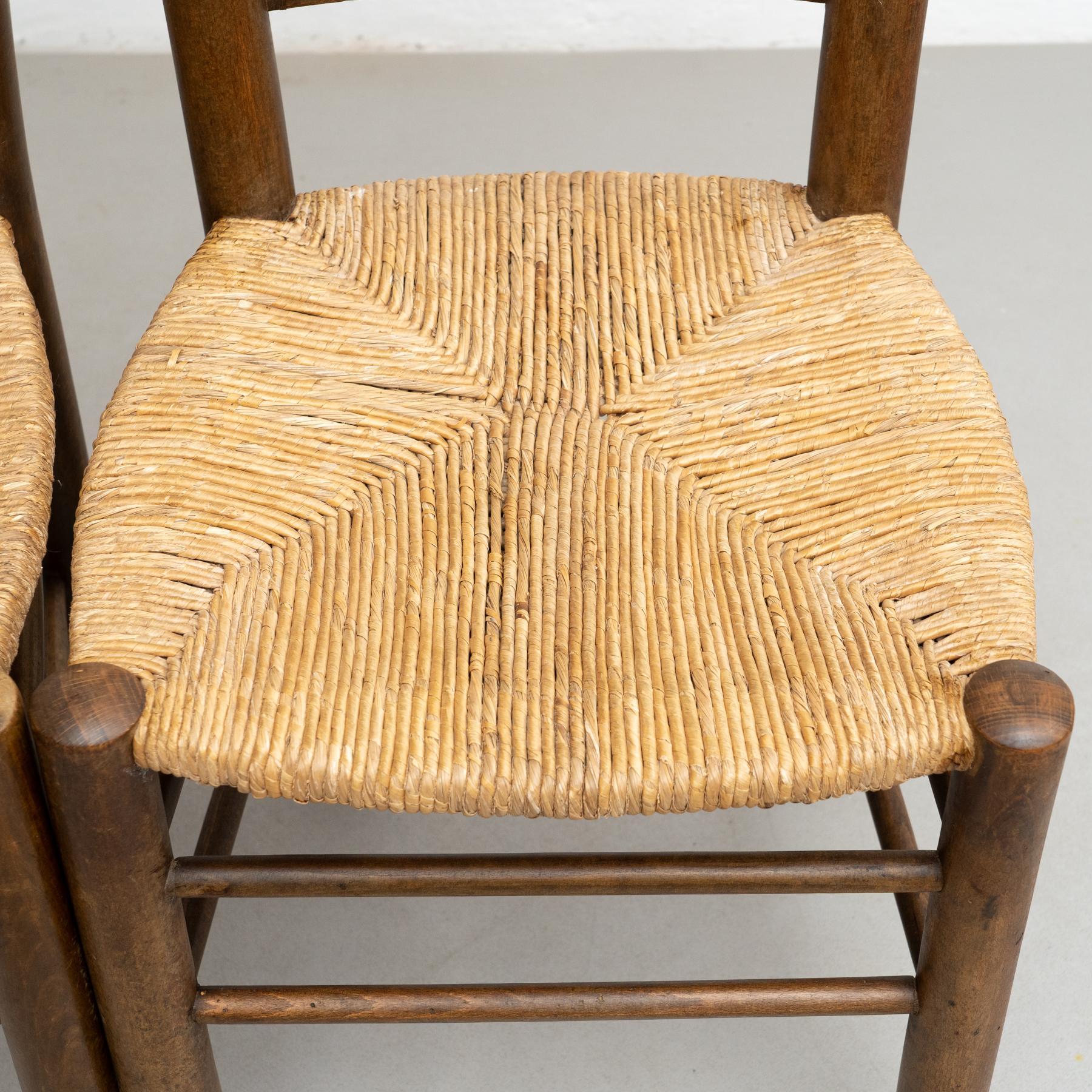 Conjunto de cuatro sillas de ratán y madera de principios del siglo XX Ratán en venta