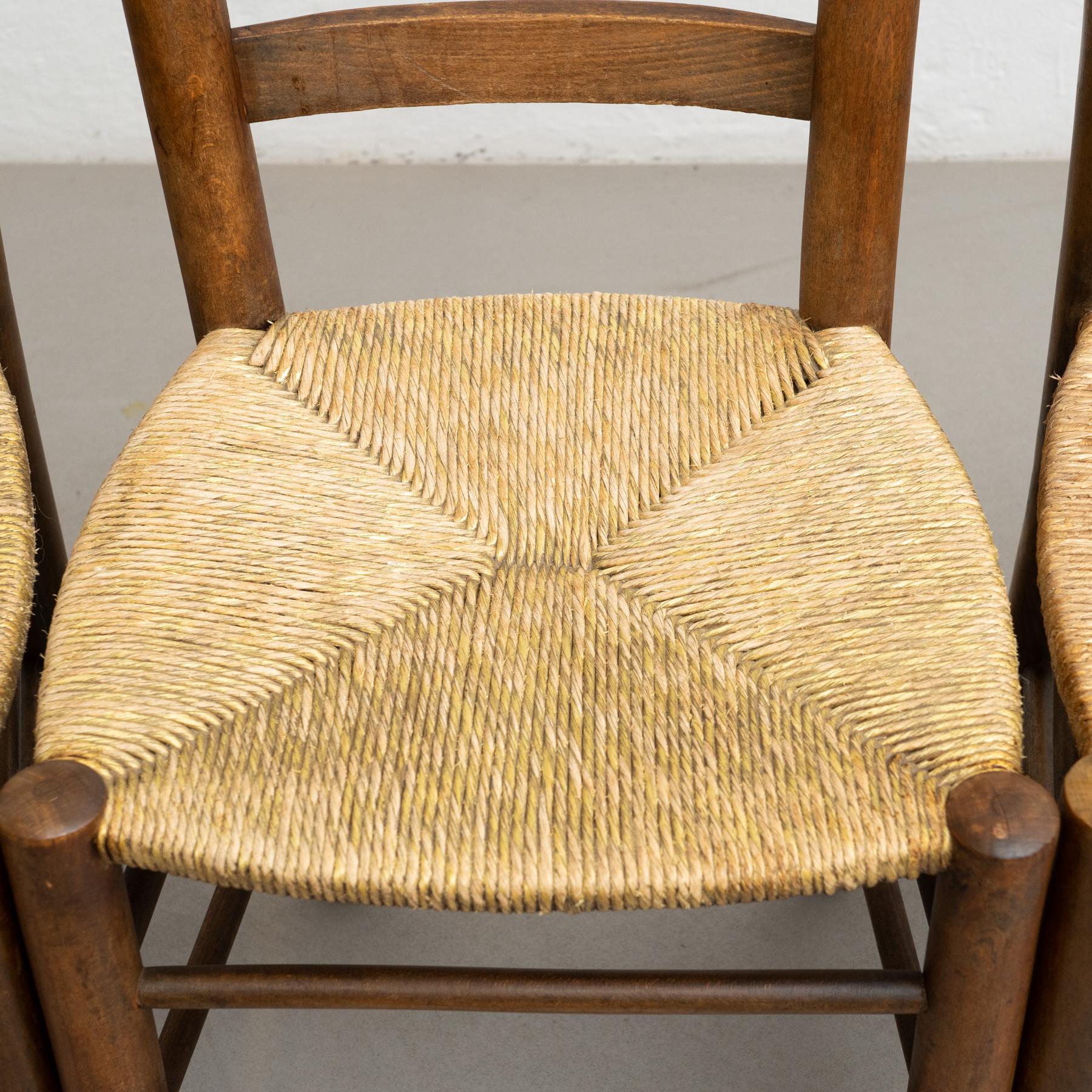 Conjunto de cuatro sillas de ratán y madera de principios del siglo XX en venta 2