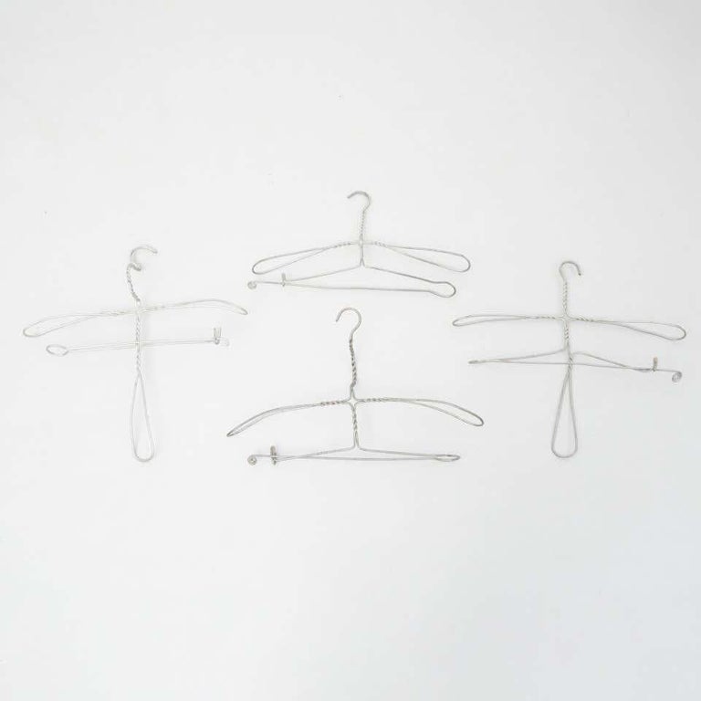 Early 20th Century Set of Four Sculptural Metal Hangers For Sale at 1stDibs