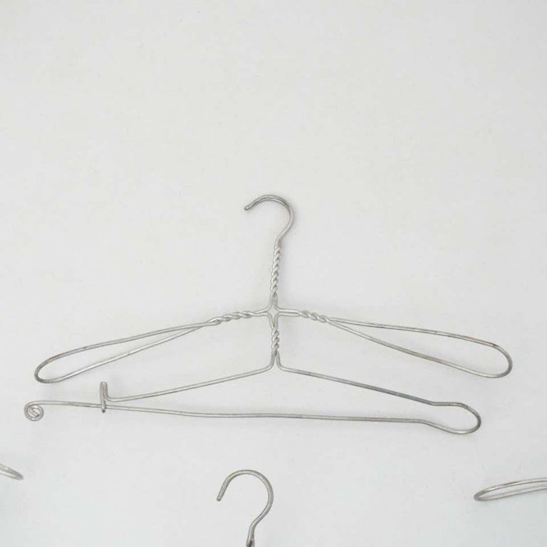 Early 20th Century Set of Four Sculptural Metal Hangers For Sale at 1stDibs