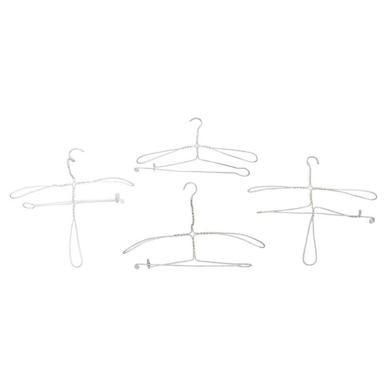 Early 20th Century Set of Four Sculptural Metal Hangers For Sale at 1stDibs