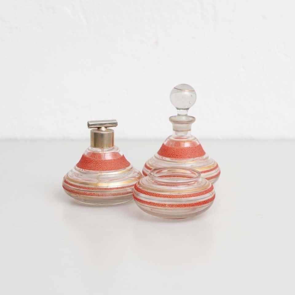Early 20th century set of three antique apothecary glass bottles. By unknown manufacturer, Spain.  In original condition, with minor wear consistent with age and use, preserving a beautiful patina.  Materials: Glass  Dimensions: Ø 11 cm x H 14 cm.