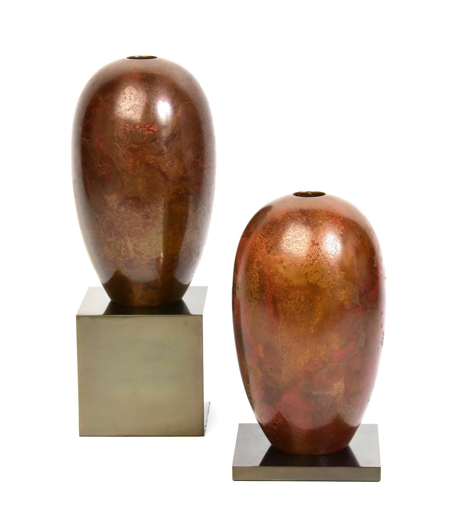 A pair of Japanese bronze vases with artist sign, used to decorate single flower arrangement in Japanese traditional tea ceremony. 
Artist signature is on the last photo.

Age: Japan, Showa Period, Early 20th Century
Size: Height 18 C.M. / Width