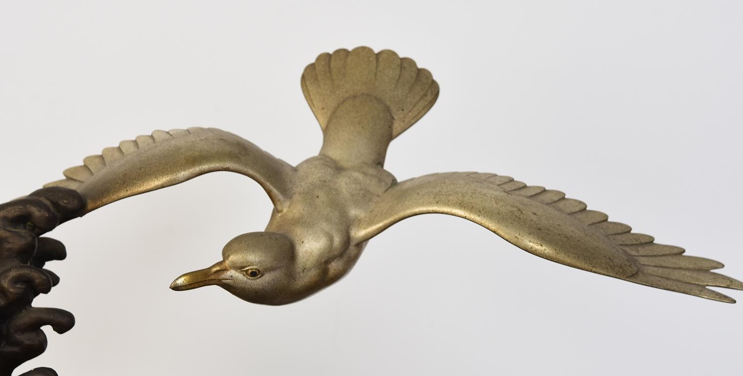 Japanese bronze flying bird with stand.

Age: Japan, Showa Period, Early 20th Century
Size: Height 25 C.M. / Width 18.3 C.M. / Length 39.7 C.M.
Size of stand: Height 4 C.M. / Width 41 C.M. / Length 54.9 C.M.
Condition: Nice condition