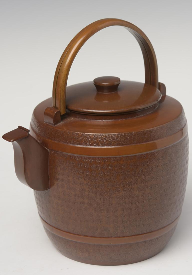 Japanese bronze and copper teapot with artist sign.

Age: Japan, Showa Period, early 20th century
Size: height 22 cm / width 19.4 cm
Condition: Nice condition overall.