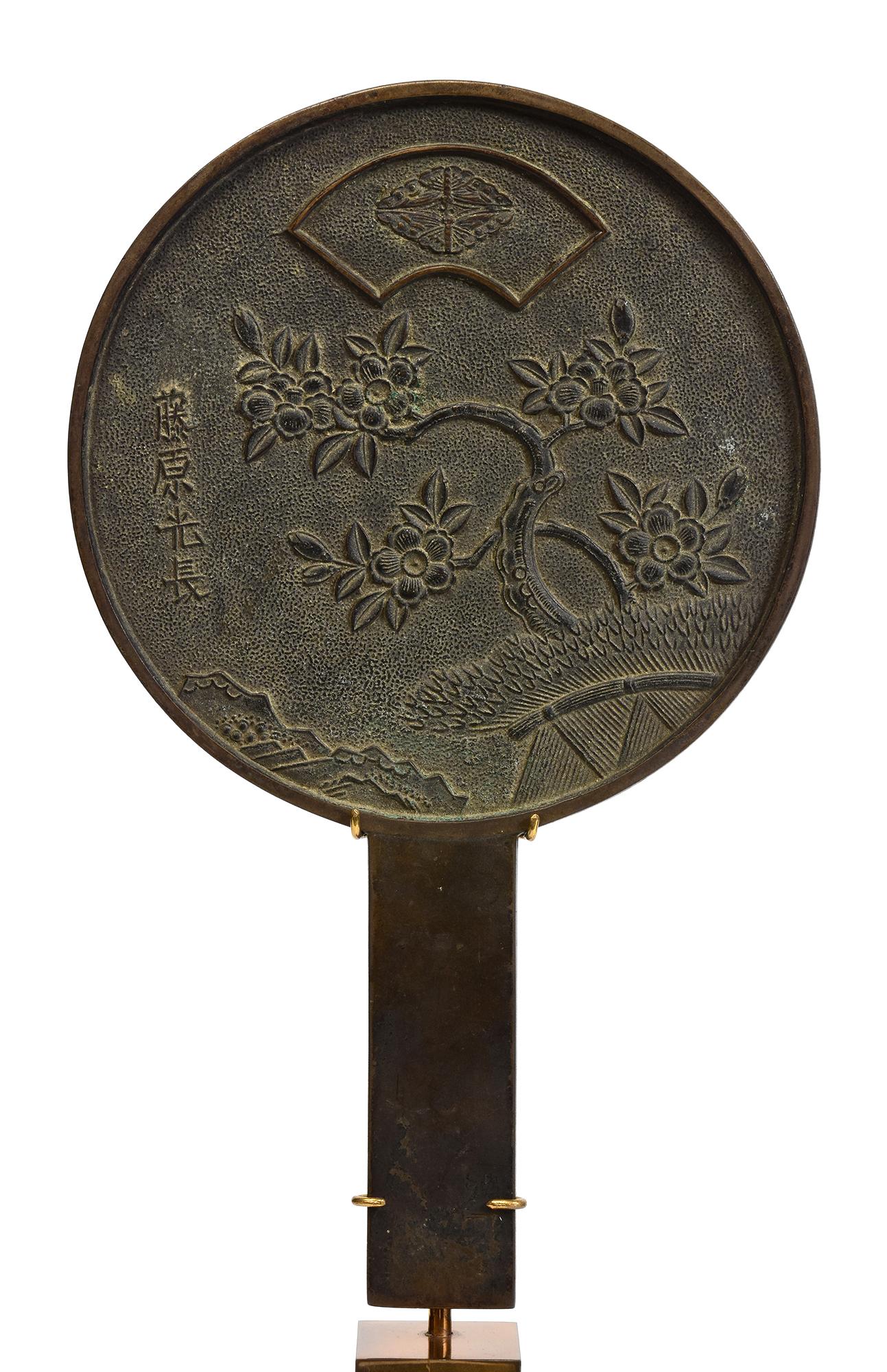 Japanese bronze mirror with stand.

Age: Japan, Showa Period, Early 20th Century
Size: Diameter 15 C.M. / Height 24.5 C.M.
Size including stand: Height 40 C.M.
Condition: Nice condition overall.