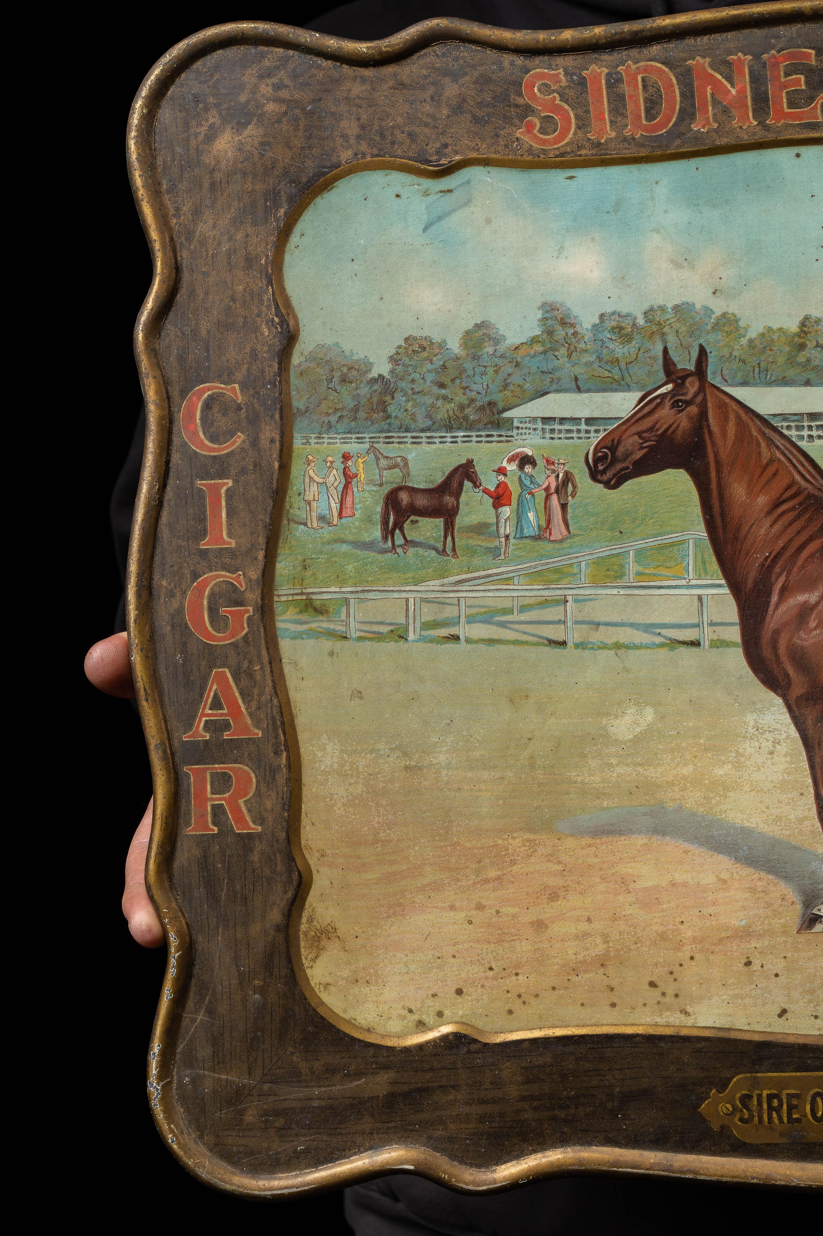 c. 1910s; The J.B. Moos Cigar Manufacturing Co. - Cincinnati, OH

Antique embossed tin cigar advertising sign with self-framing.

This sign advertises Sidney Dillon cigars, a brand named for the famous American Trotter racehorse who broke the