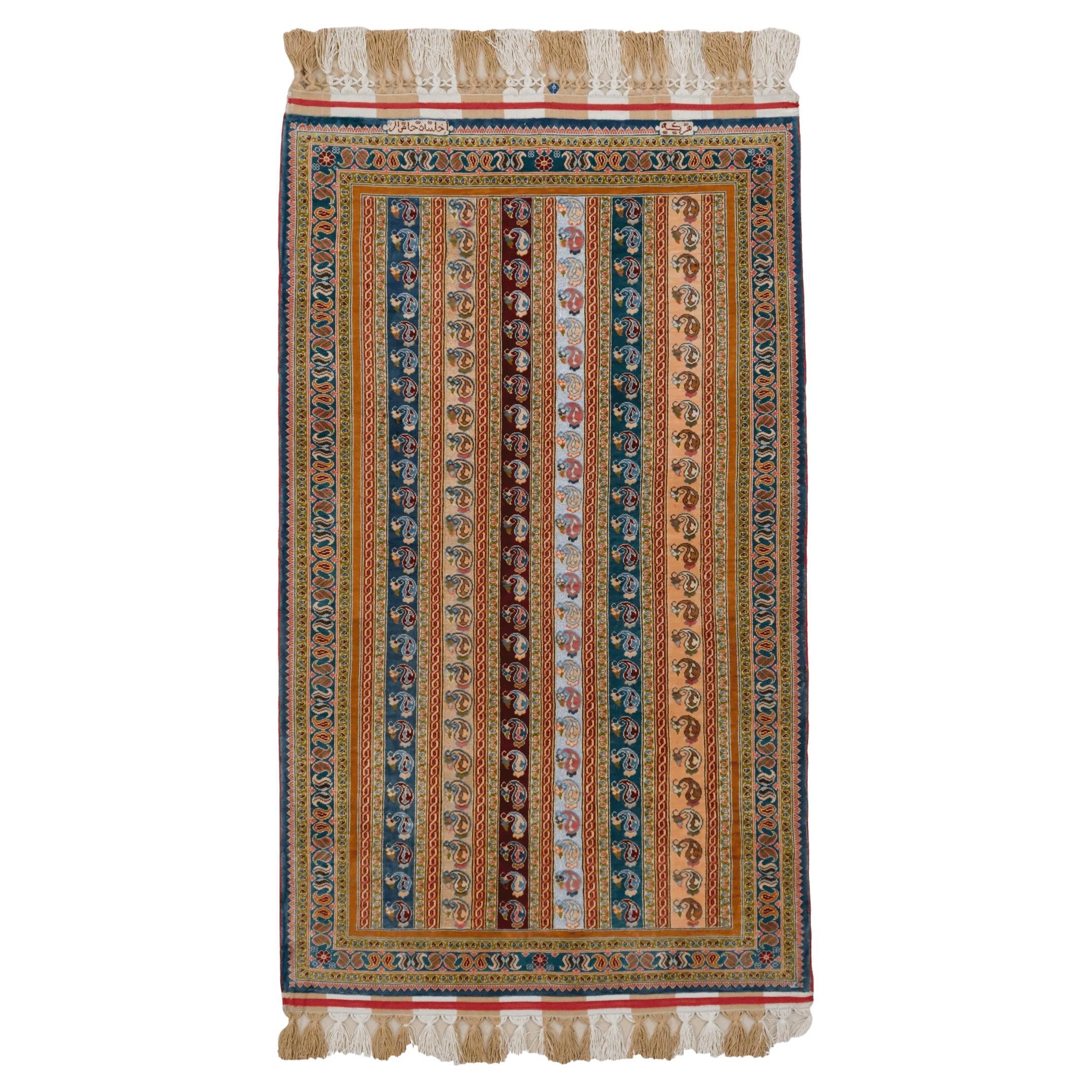 Tapis en soie et métal signé Hereke du début du 20e siècle par l'atelier Hasoglu en vente