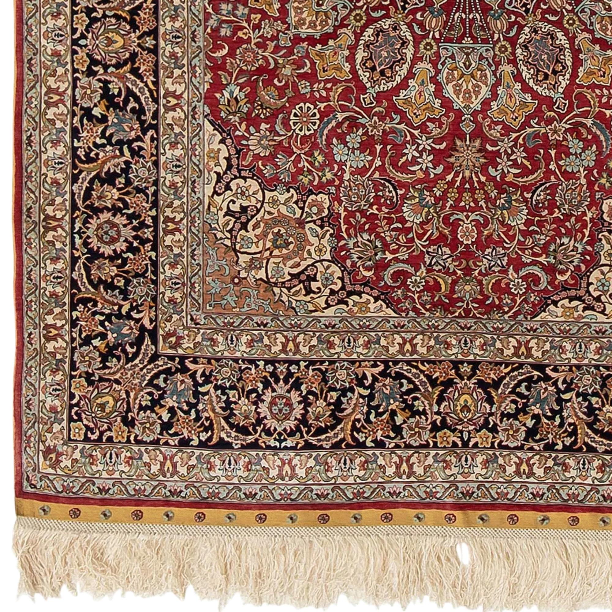NW Turkey, around 1970. Pile material and chain pure silk. At the top center signed with “Uzubek”. Fine knotting (15×15 knots per cm.). In the elegant red midfield appears an artfully designed 16-pass round medallion with artistic traffic light and