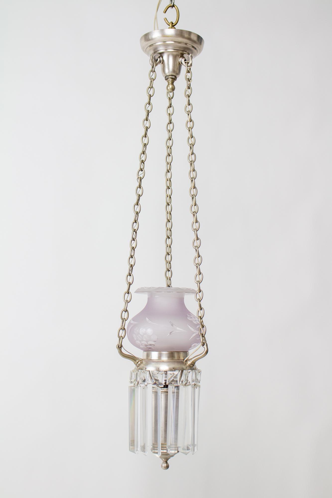 Silver and crystal argand pendant light. This would be excellent for a high ceilinged entryway or a stairway. A central light hangs from three strands of delicate chain. The light has a single frosted and cut glass shade, and is hung with a ring of