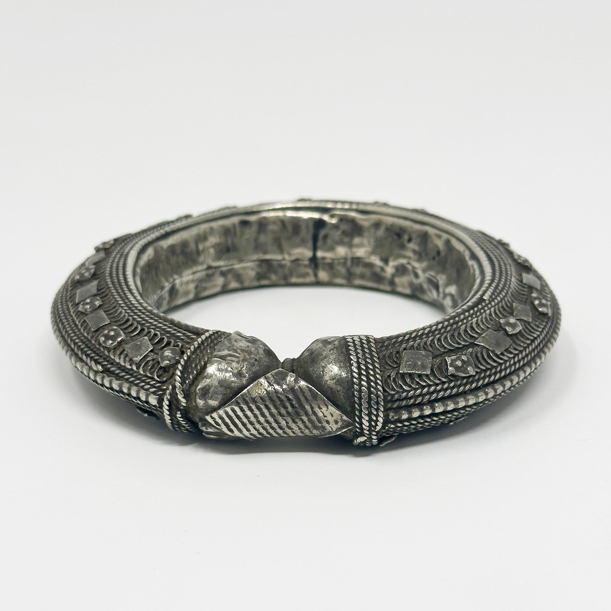 Early 20th Century Silver Filigree Bracelet, Yemen

A hollow silver filigree bracelet made in Yemen in the first half of the 20th century. The interior diameter is 2.75 inches and it is .75 inches thick, weighing in at 100 grams.
