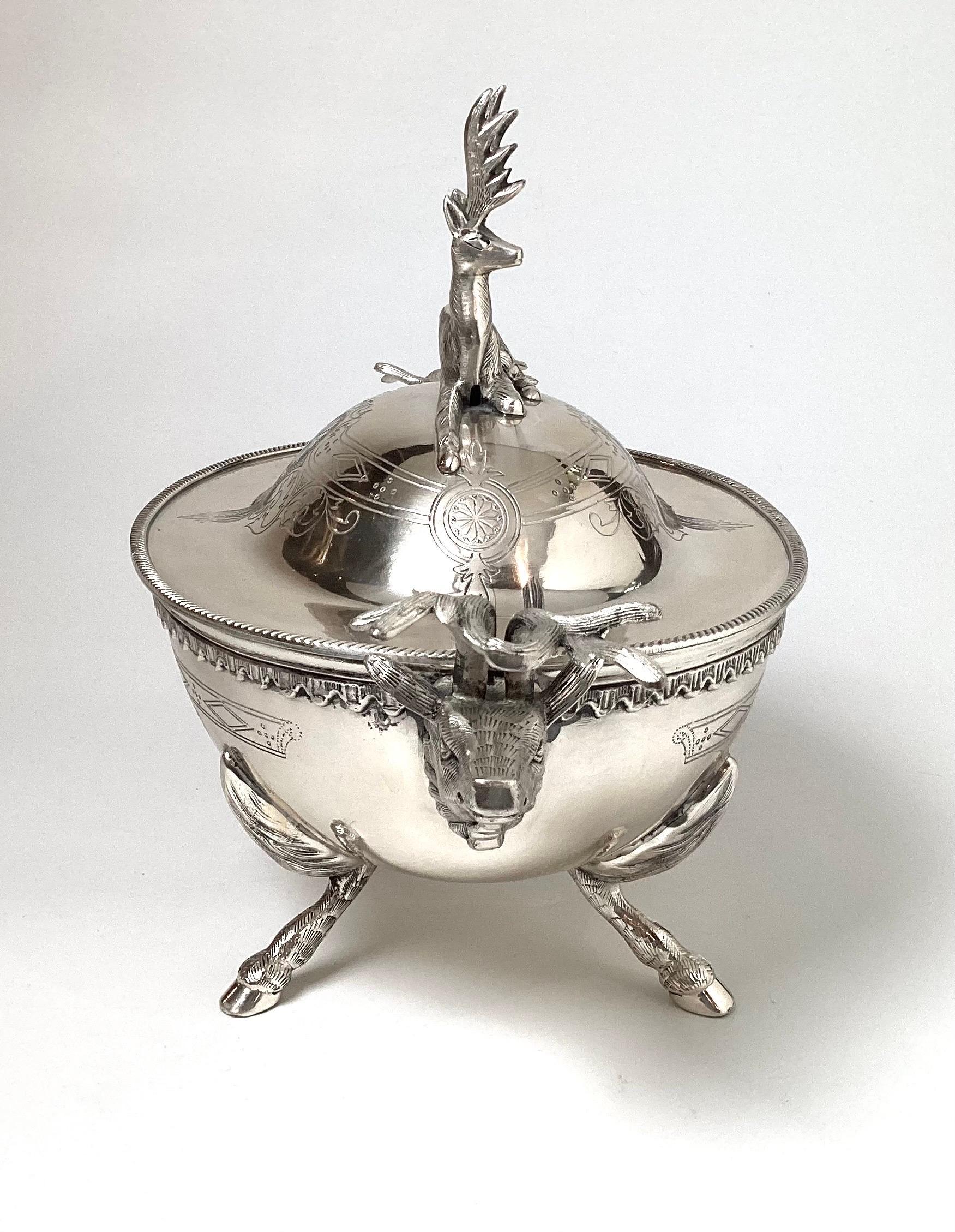 A handsome early 20th Century silver plate tureen with lid. The engraved body with elk motif top handle and side handles, the silvering in excellent condition. 17 wide from handle to handle.